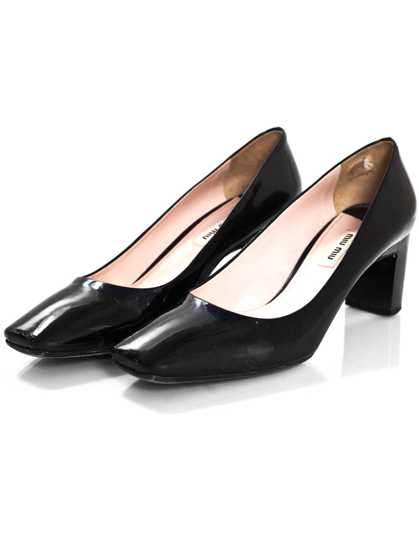 Miu Miu Black Patent Pumps with Crystal Heels Sz 39.5

Made In: Italy
Color: Black
Materials: Patent leather
Closure/Opening: Slide on
Sole Stamp: Miu Miu Made in Italy 39.5
Overall Condition: Excellent pre-owned condition with the exception of