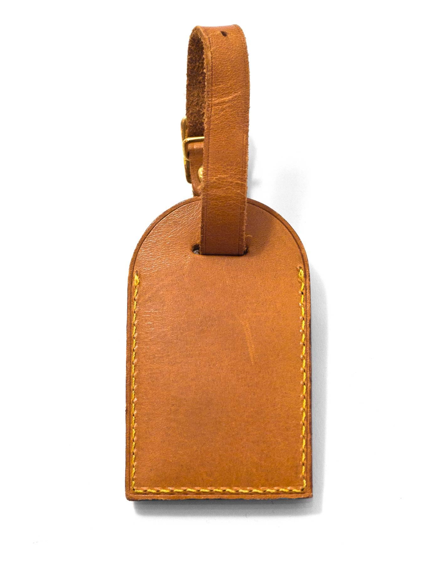 Louis Vuitton Luggage Tag

Made In: France
Color: Tan
Hardware: Goldtone
Materials: Vachetta leather
Closure/Opening: Buckle closure
Overall Condition: Very good pre-owned condition with the exception of cracking at strap, faint surface