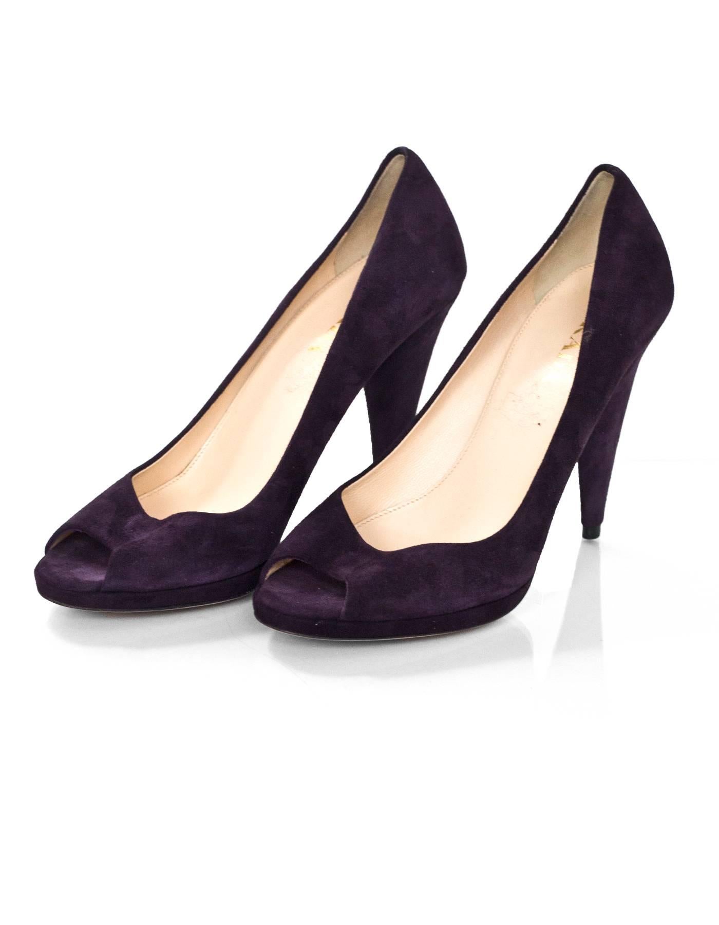 Prada Purple Suede Open-Toe Pumps Sz 37.5

Made In: Italy
Color: Purple
Materials: Suede
Closure/Opening: Slide on
Sole Stamp: Prada 37.5 Made in Italy
Overall Condition: Excellent pre-owned condition, light wear at insoles and outsoles, marks at