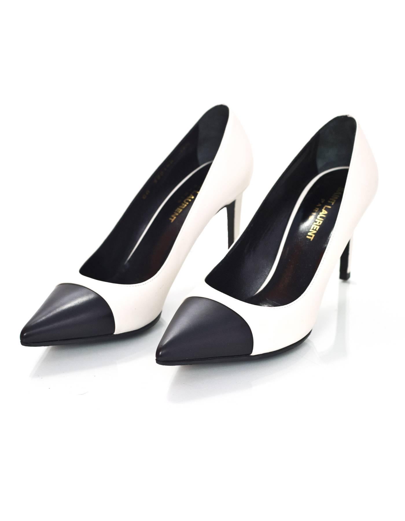 Saint Laurent White & Black Leather Pumps Sz 36.5

Made In: Italy
Color: White, black
Materials: Leather
Closure/Opening: Slide on
Sole Stamp: Saint Laurent Paris Made in Italy 36.5
Retail Price: $665 + tax
Overall Condition: Excellent pre-owned