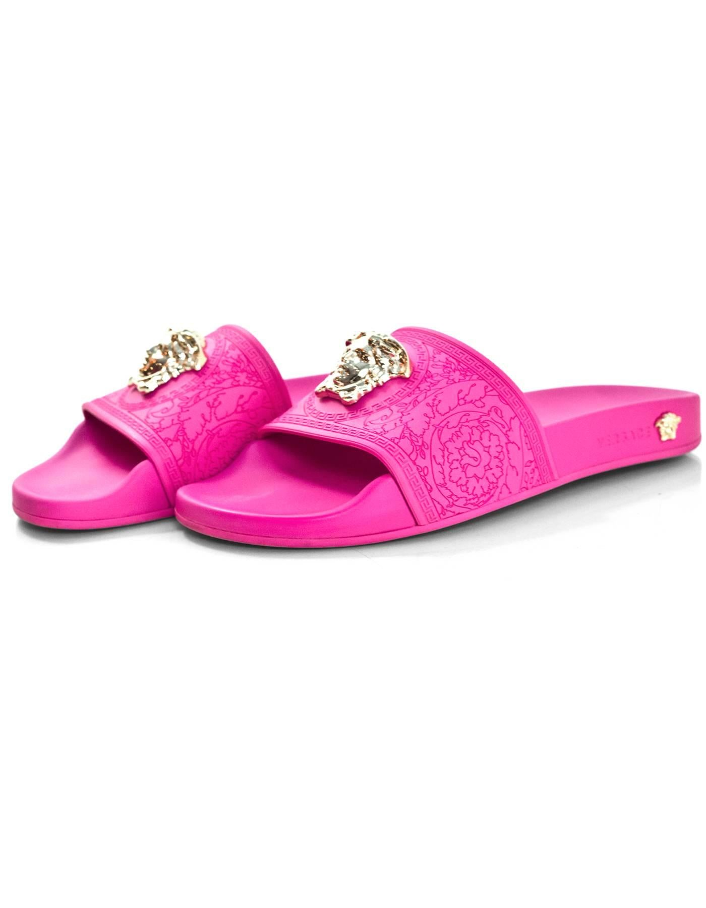 Versace Hot Pink Medusa Slide Sandals Sz 39

Made In: Italy
Color: Hot pink
Retail Price: $395 + tax
Materials: Rubber
Closure/Opening: Slide
Sole Stamp: Versace Made in Italy
Overall Condition: Excellent pre-owned condition with the exception of