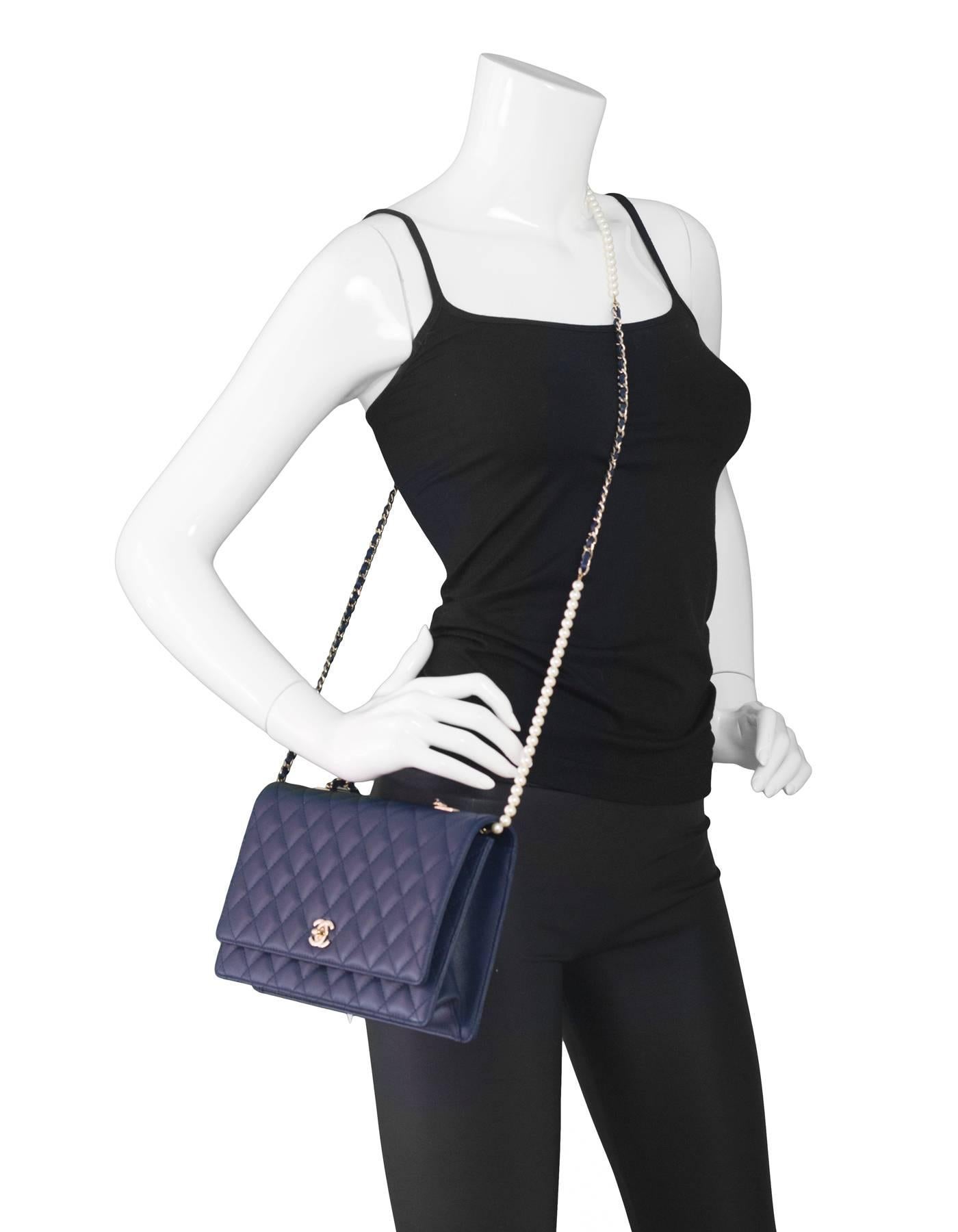 Chanel Navy Lambskin Large Fantasy Pearls Crossbody Flap Bag
Features delicate chainlink and pearl crossbody strap

Made In: Italy
Year of Production: 2016
Color: Navy
Hardware: Goldtone
Materials: Lambskin, metal, faux pearl
Lining: Navy