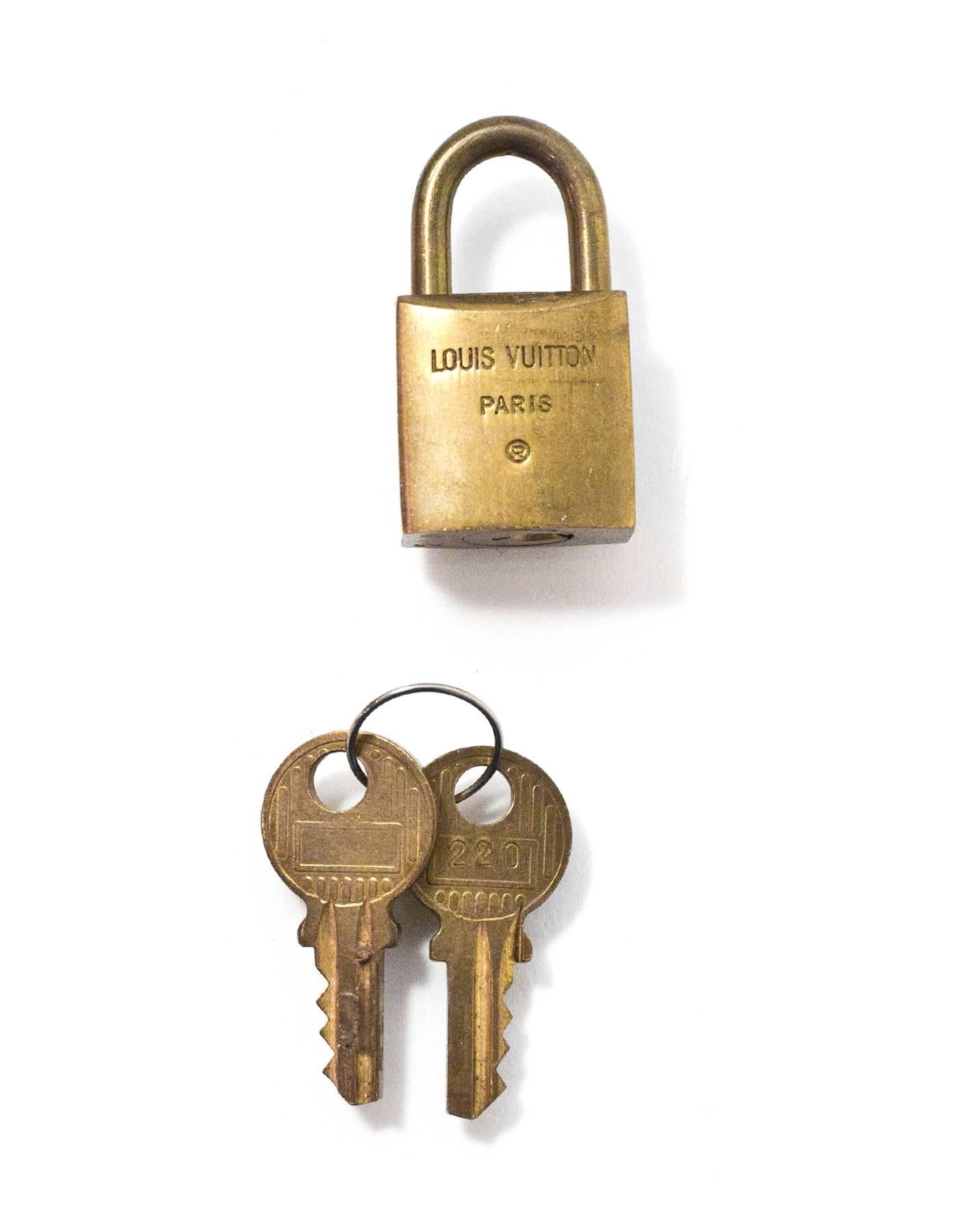 Louis Vuitton Vintage Brass Logo Lock & Keys

Color: Gold
Hardware: Brass
Materials: Metal
Stamp: Louis Vuiton Paris 220
Retail Price: $91 + tax
Overall Condition: Very good good pre-owned condition, light tarnish throughout
Includes: Lock, two