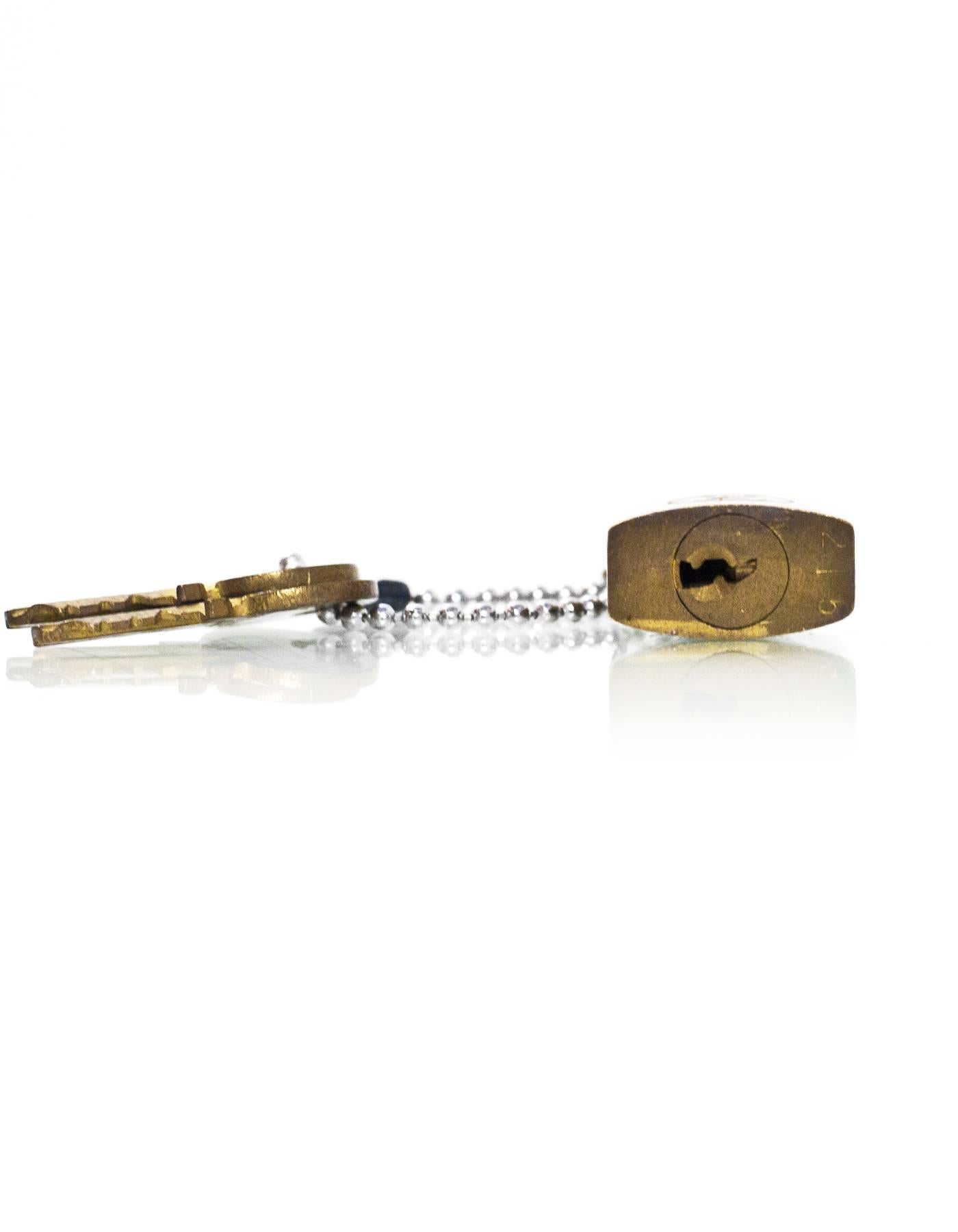 Louis Vuitton Vintage Brass Logo Lock & Keys In Good Condition In New York, NY