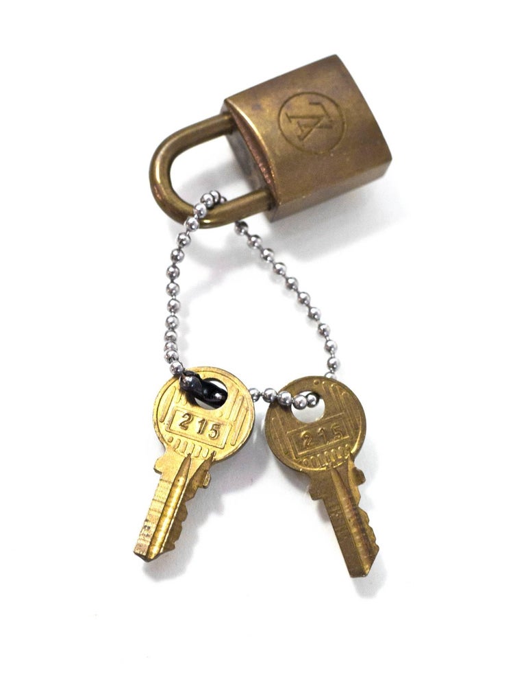 Louis Vuitton Vintage Brass Logo Lock and Keys at 1stdibs