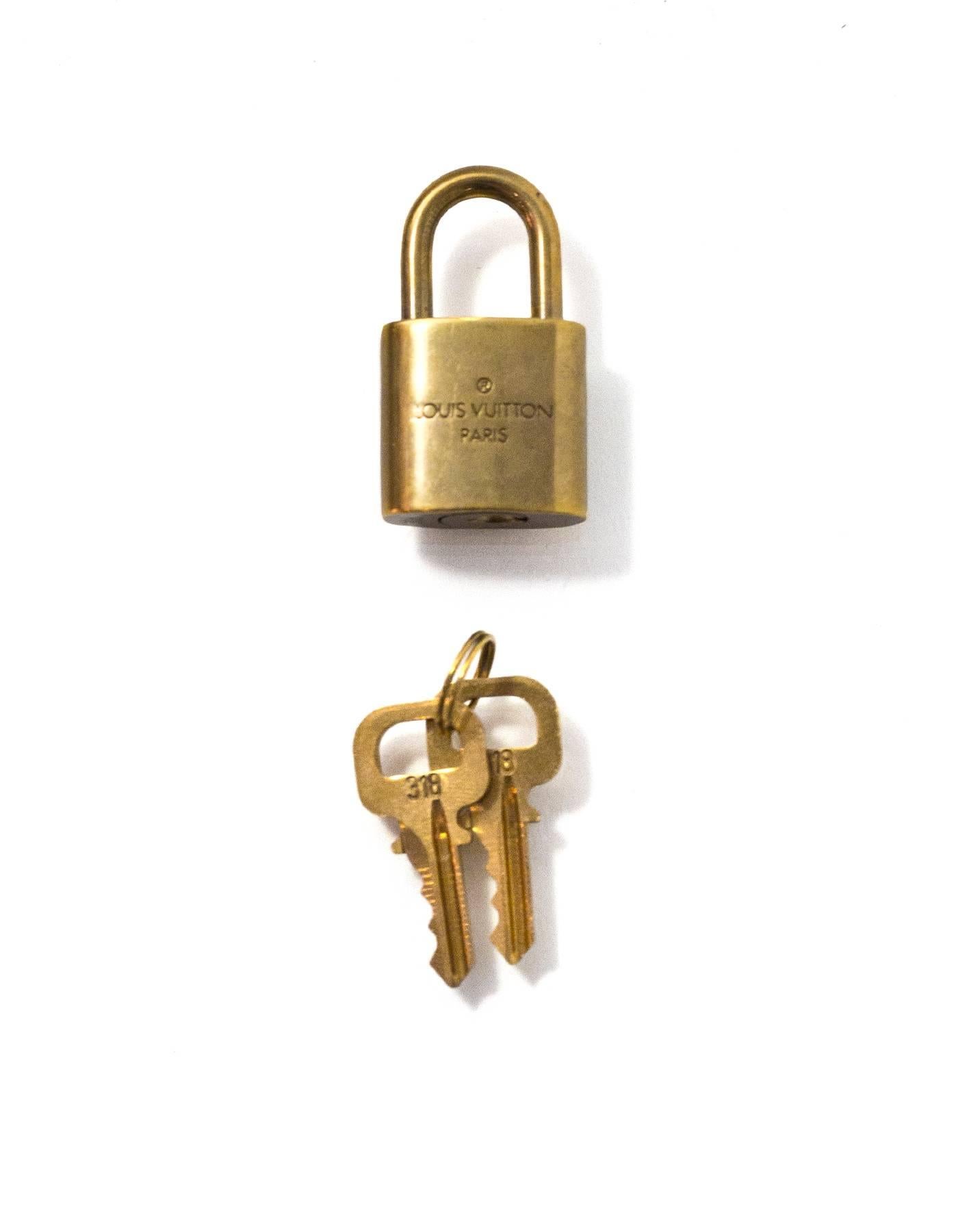 Louis Vuitton Brass Logo Lock & Keys

Color: Gold
Hardware: Brass
Materials: Metal
Stamp: Louis Vuitton 318
Retail Price: $91 + tax
Overall Condition: Very good good pre-owned condition, light tarnish throughout
Includes: Lock, two keys,
