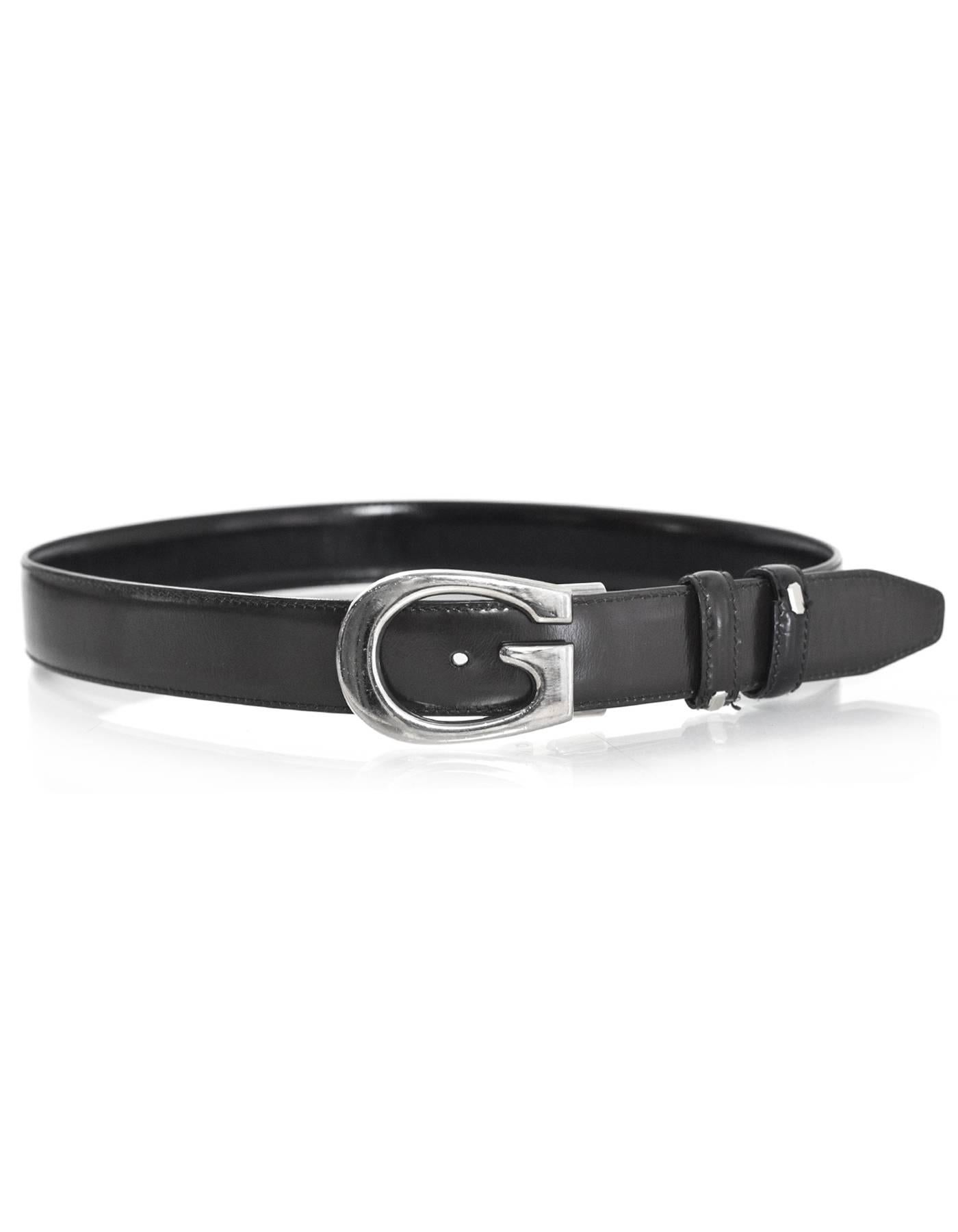 Gucci Black & Brown Reversible Leather G Belt Sz 75

Made In: Italy
Color: Black, bown
Hardware: Silvertone
Materials: Leather, metal
Closure/Opening: Stud and notch closure
Stamp: Gucci - remainder has been cut off
Overall Condition: Very good