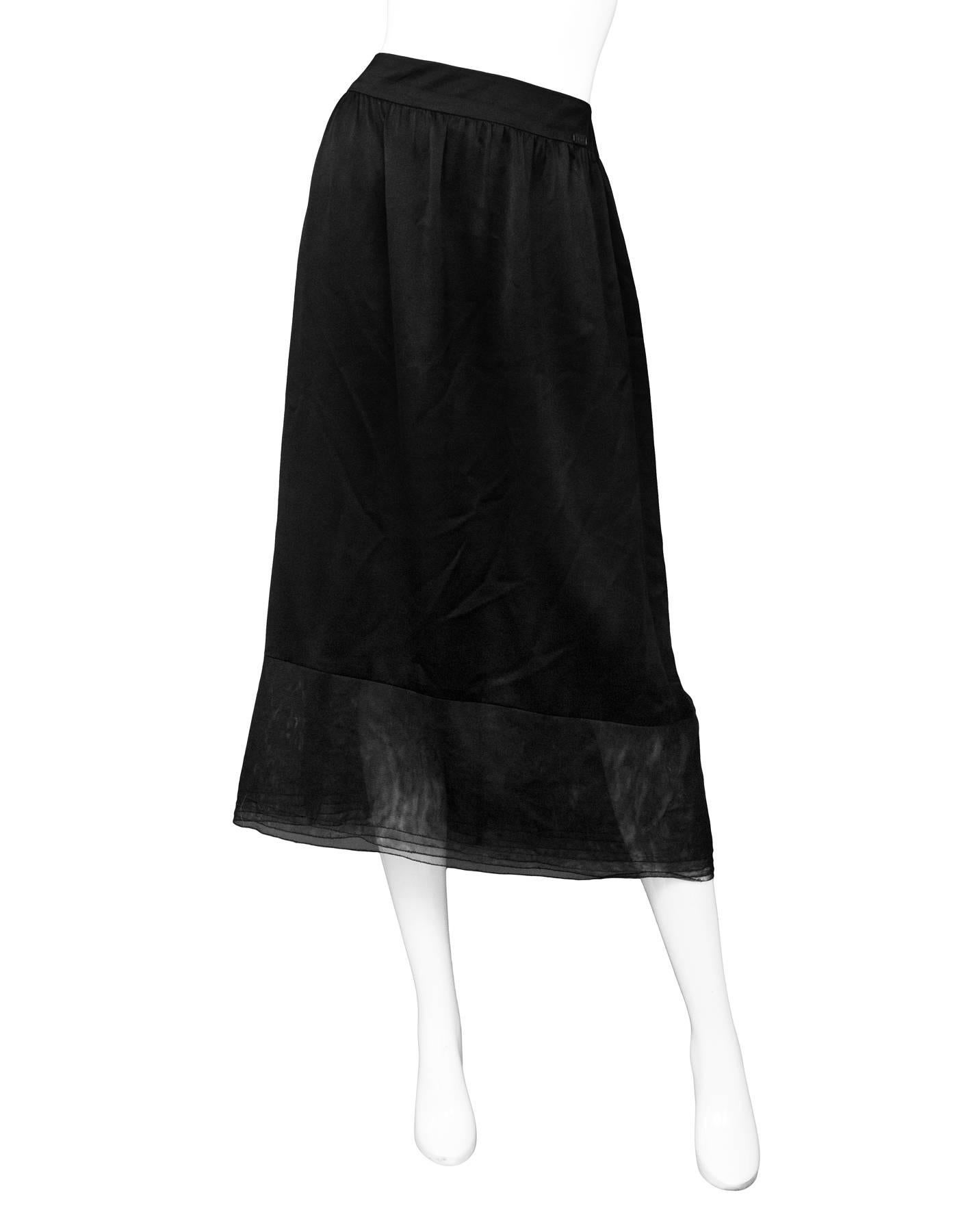 Chanel Black Silk Skirt Sz FR42

Made In: France
Year of Production: 1999
Color: Black
Composition: 100% Silk
Lining: Black silk
Closure/Opening: Back zip closure
Overall Condition: Excellent pre-owned condition
Marked Size: FR42/ US10
Waist: