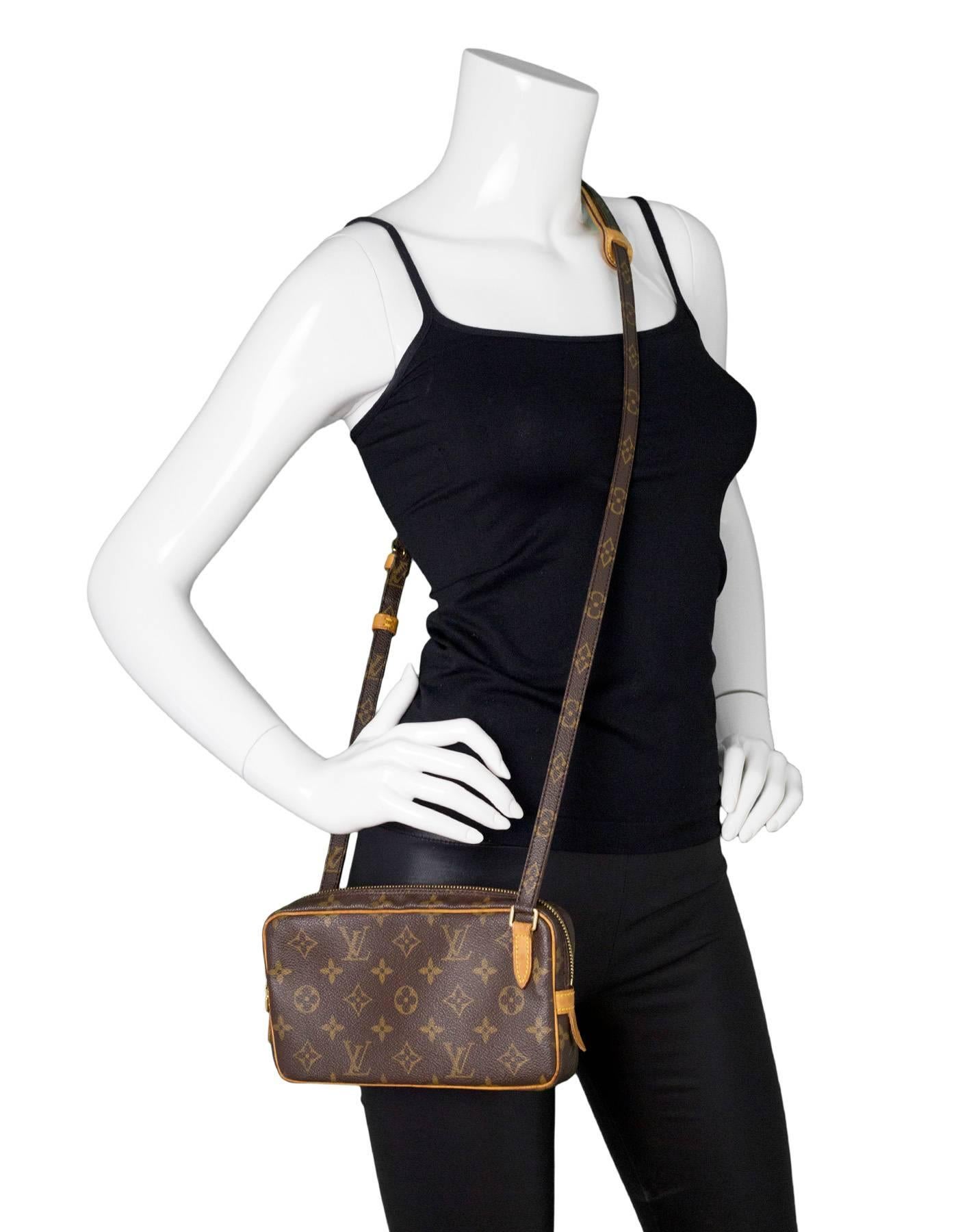 Louis Vuitton Vintage Monogram Marly Bandouliere Crossbody Bag

Made In: France
Year of Production: 1990
Color: Brown
Hardware: Goldtone
Materials: Coated canvas and vachetta leather
Lining: Brown coated canvas
Closure/Opening: Zip top