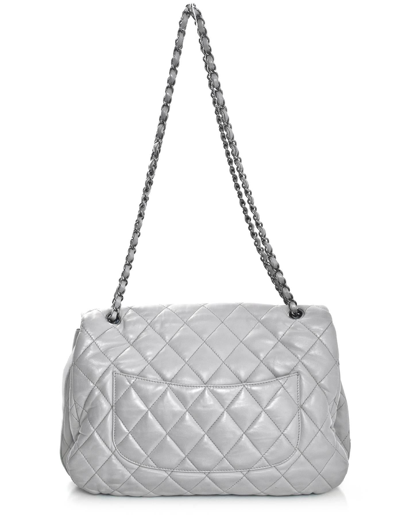 Chanel Grey Quilted Lambskin Maxi Chanel 3 Accordion Flap Bag
Features adjustable shoulder straps

Made In: Italy
Year of Production: 2011
Color: Grey
Hardware: Ruthenium
Materials: Leather
Lining: Charcoal satin
Closure/Opening: Flap top with CC