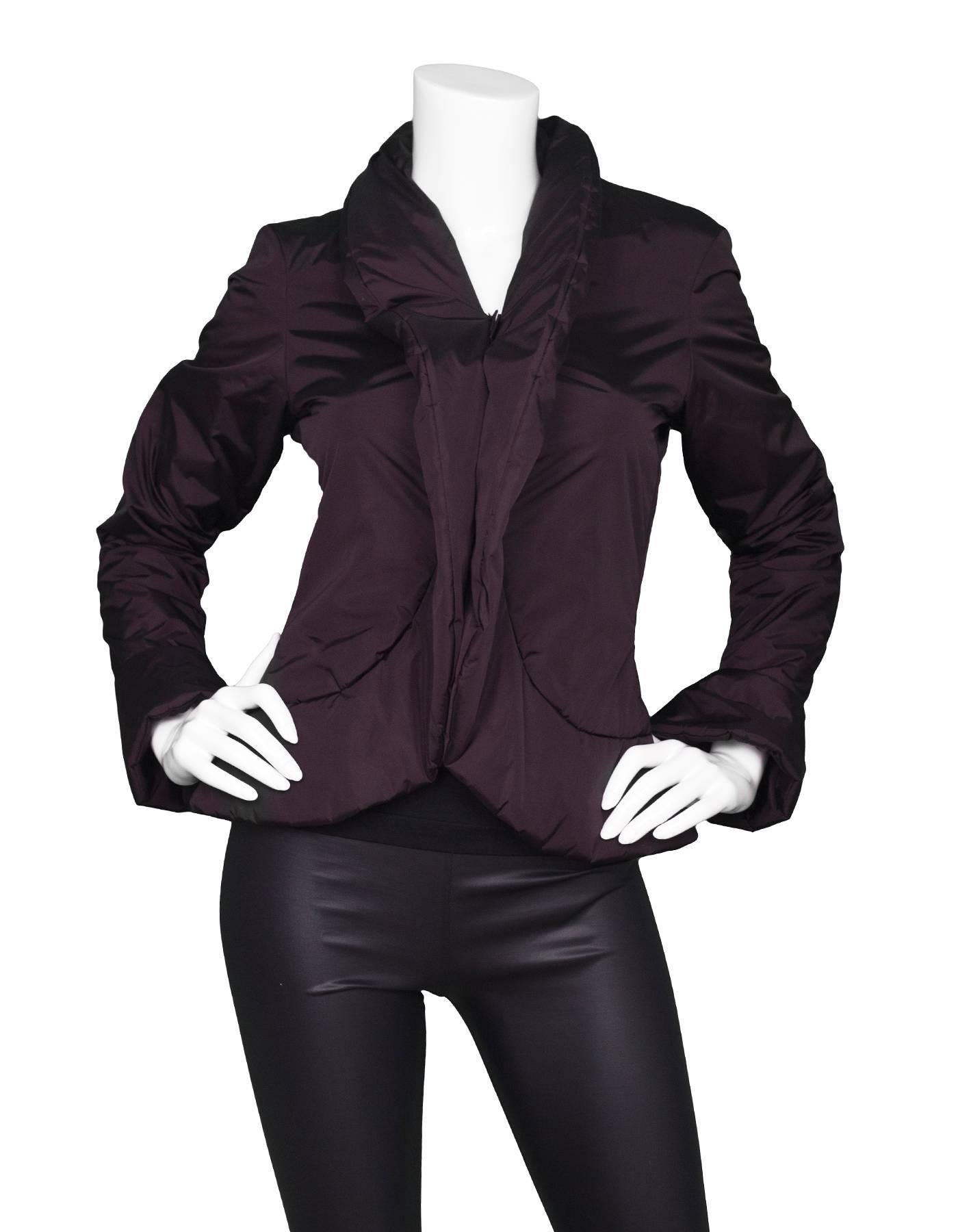 Jean Paul Gaultier Eggplant Peplum Puffer Jacket
Features bell sleeves

Made In: Italy
Color: Eggplant
Composition: 91% polyamide, 9% polyurethane
Lining: Eggplant, 100% cotton
Closure/Opening: Velcro front closure
Exterior Pockets: None
Interior 