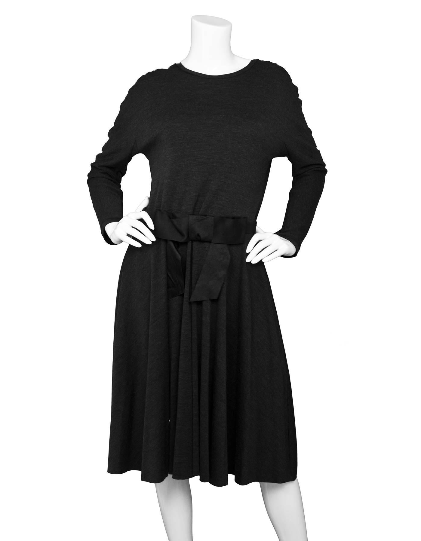 Lanvin Grey Wool Long Sleeve Fit Flare Dress
Features elastic waist belt with satin bow

Made In: Romania
Color: Grey
Composition: 100% wool
Lining: None
Closure/Opening: Back center zip up
Exterior Pockets: Two hip pockets
Interior Pockets: