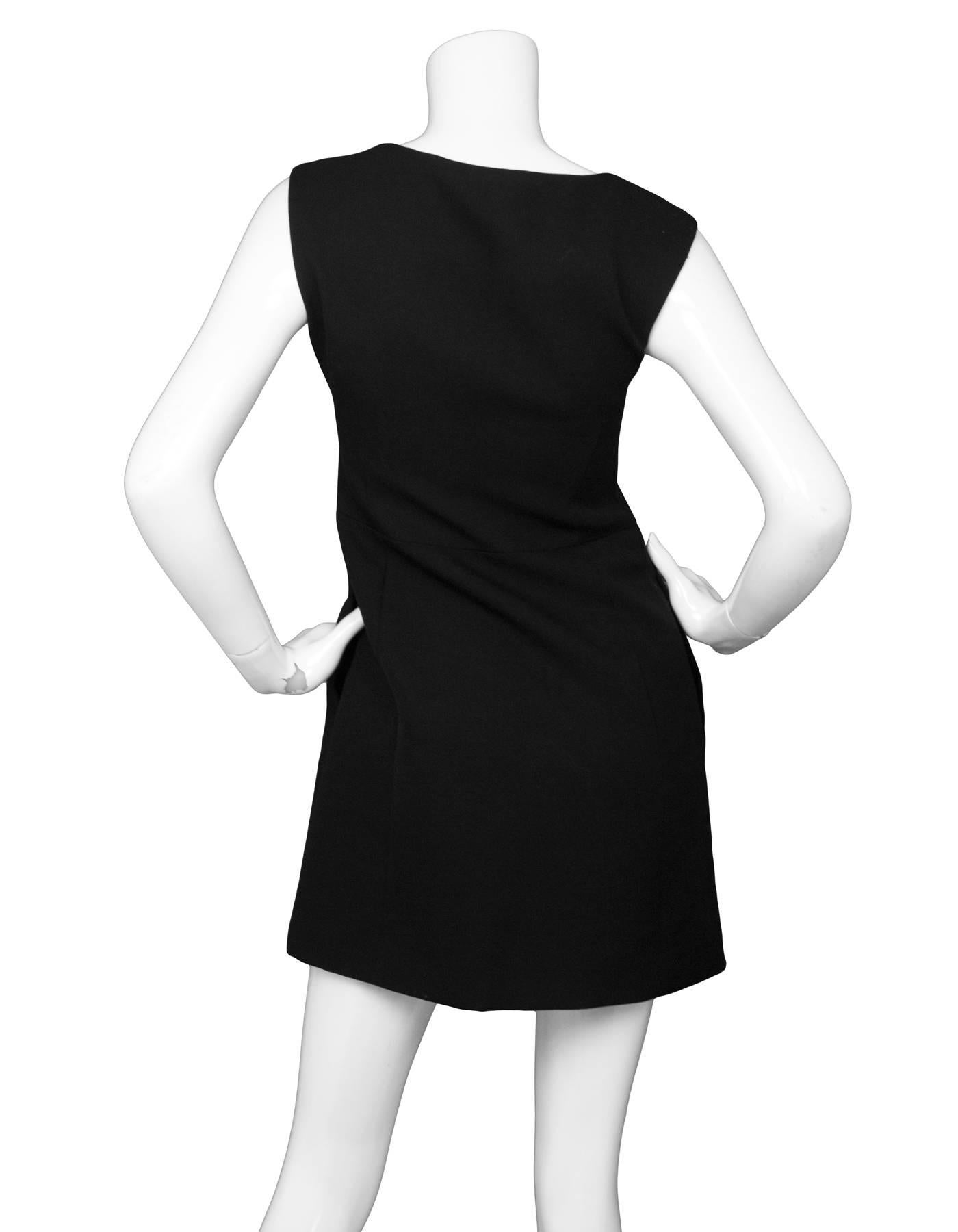 Prada Black Wool Sleeveless A-Line Dress 

Made In: Italy
Color: Black
Composition: 100% wool
Lining: Black, 100% cupro
Closure/Opening: Zip up side closure
Exterior Pockets: Two hip pockets
Interior Pockets: None
Overall Condition: Excellent