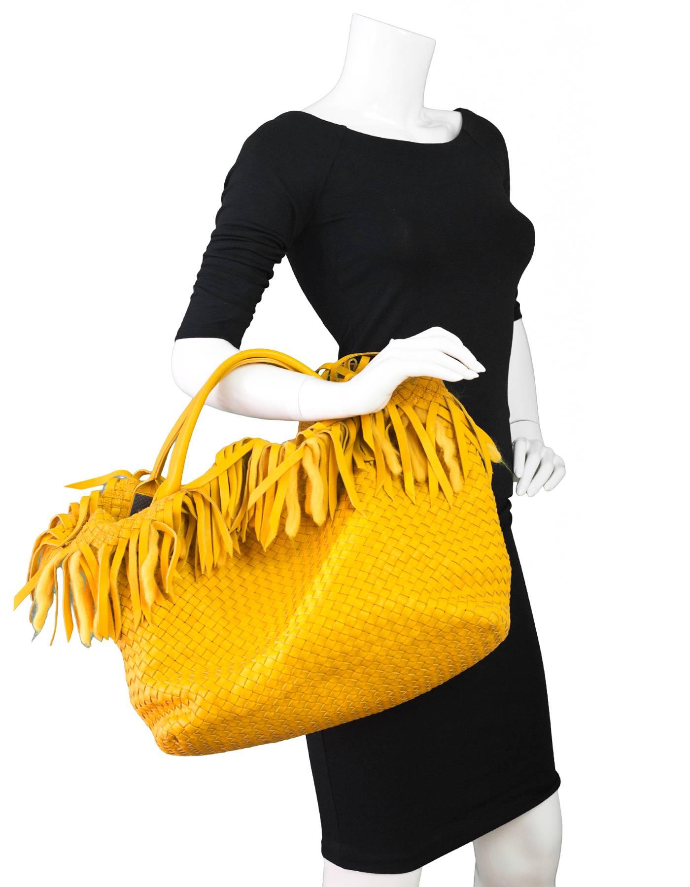 Bottega Veneta Mustard Leather & Wool Limited Ed Intrecciato Tote
Features leather and wool fringe trim, attached pochette

*This is a rare item - only 300 were made and sold in Italy*

Made In: Italy
Color: Mustard yellow
Hardware: