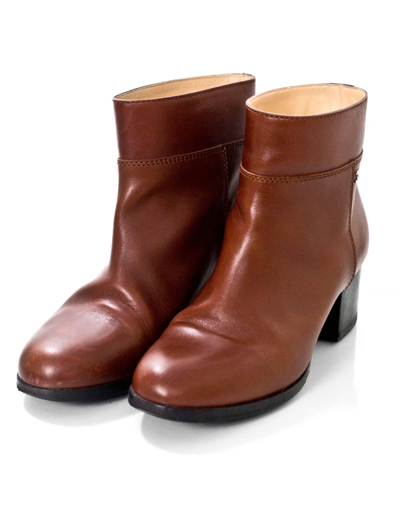 Chanel Brown Leather Ankle Boots Sz 37

Made In: Italy
Color: Brown
Materials: Leather
Closure/Opening: Pull on
Sole Stamp: CC 37
Overall Condition: Excellent pre-owned condition with the exception of light wear at outsoles, light creasing at