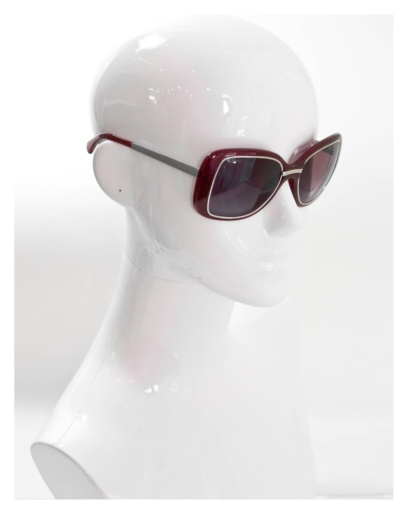 Chanel Burgundy & Silver Sunglasses

Made In: Italy
Color: Burgundy, silver
Materials: Metal and resin
Overall Condition: Excellent pre-owned condition, light surface marks throughout

Measurements: 
Across: 5.5"
Lens: 2.25"
Arm:
