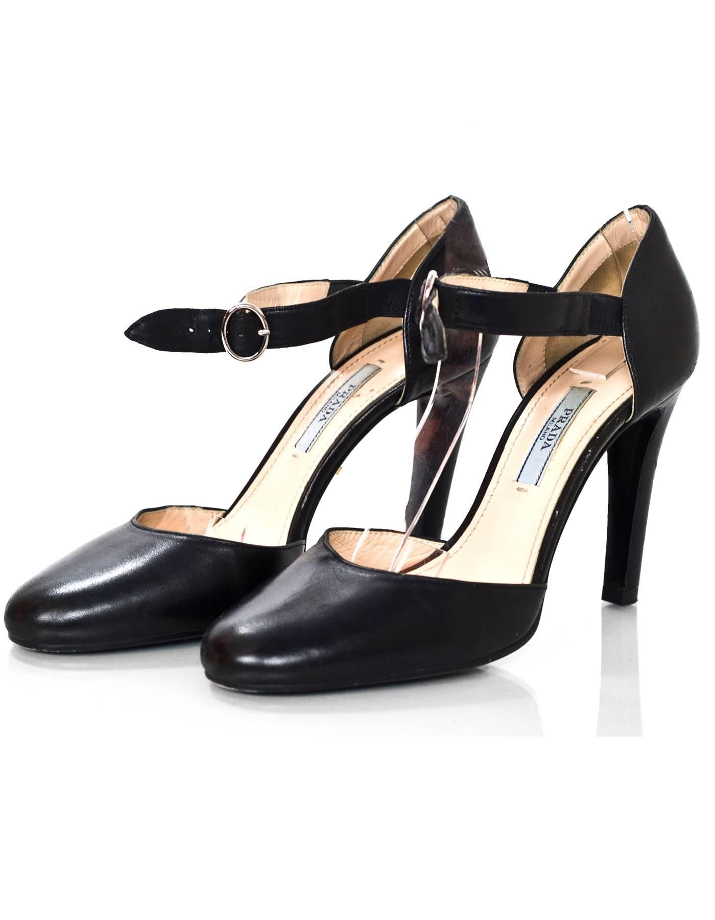 Prada Black Leather d'Orsay Pumps Sz 36

Made In: Italy
Color: Black
Materials: Leather
Closure/Opening: Buckle closure at ankle
Sole Stamp: Prada 36 Made in Italy
Overall Condition: Excellent pre-owned condition, light wear at insoles and