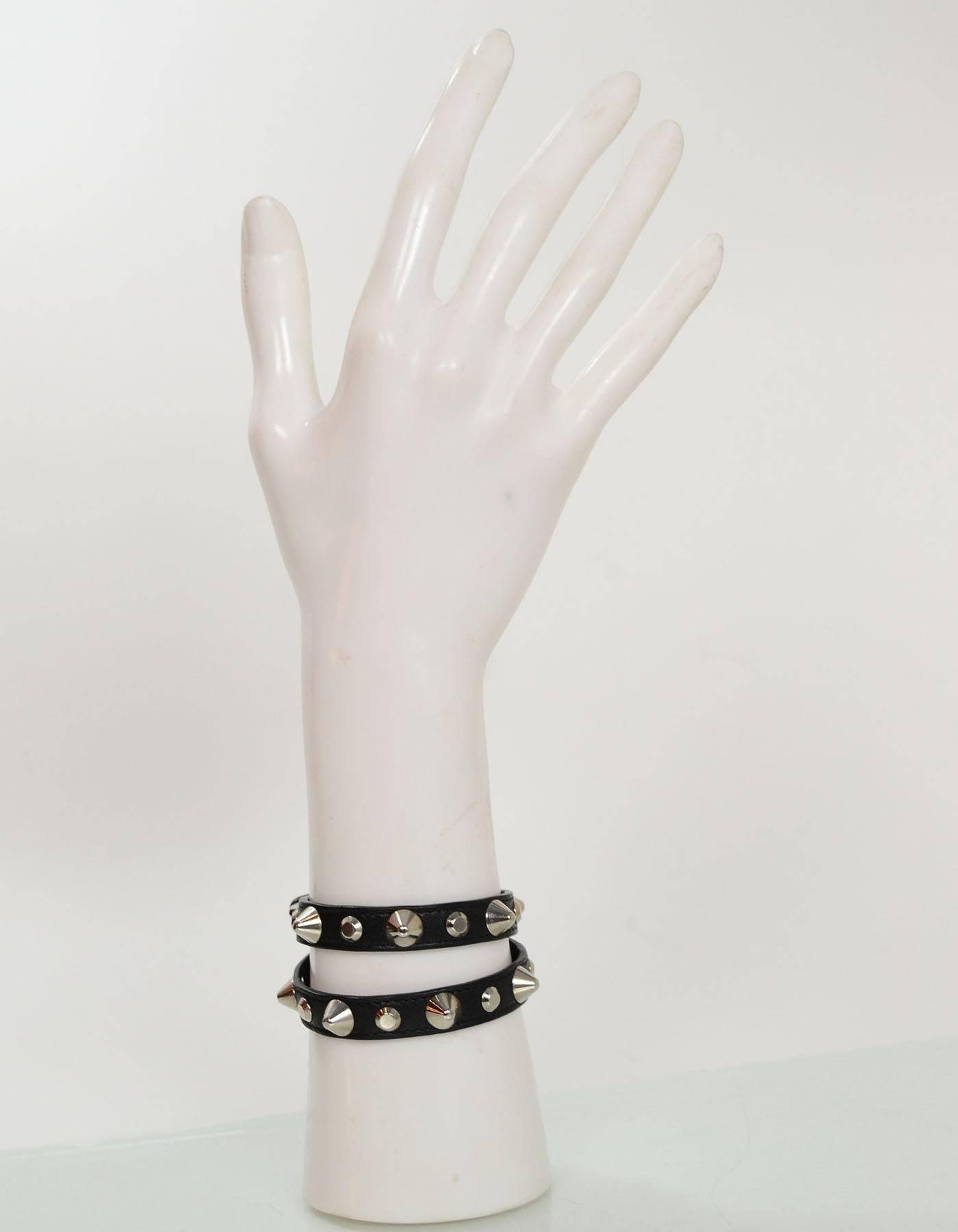 Saint Laurent Black Leather Studded Choker/Bracelet

Color: Black
Hardware: Silvertone
Materials: Leather and metal
Closure/Opening: Buckle closure
Stamp: Saint Laurent Paris
Retail Price: $495 + tax
Overall Condition: Excellent pre-owned conditon,