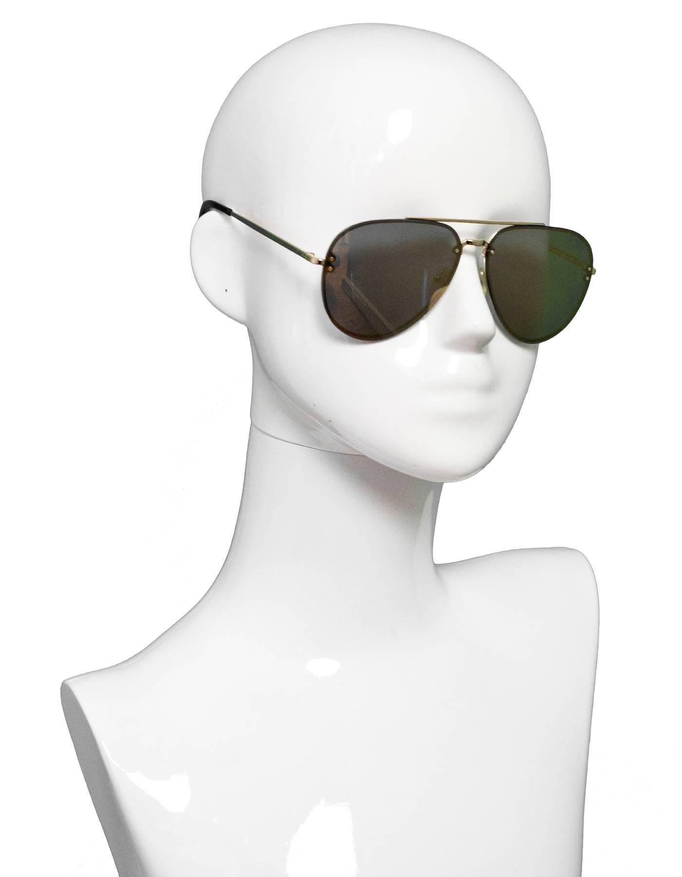 Celine Gold Mirrored Aviator Sunglasses

Made In: Italy
Color: Gold
Materials: Metal
Overall Condition: Excellent pre-owned condition, light surface marks
Includes: Celine case and cloth

Measurements: 
Length Across: 5.75"
Lens: