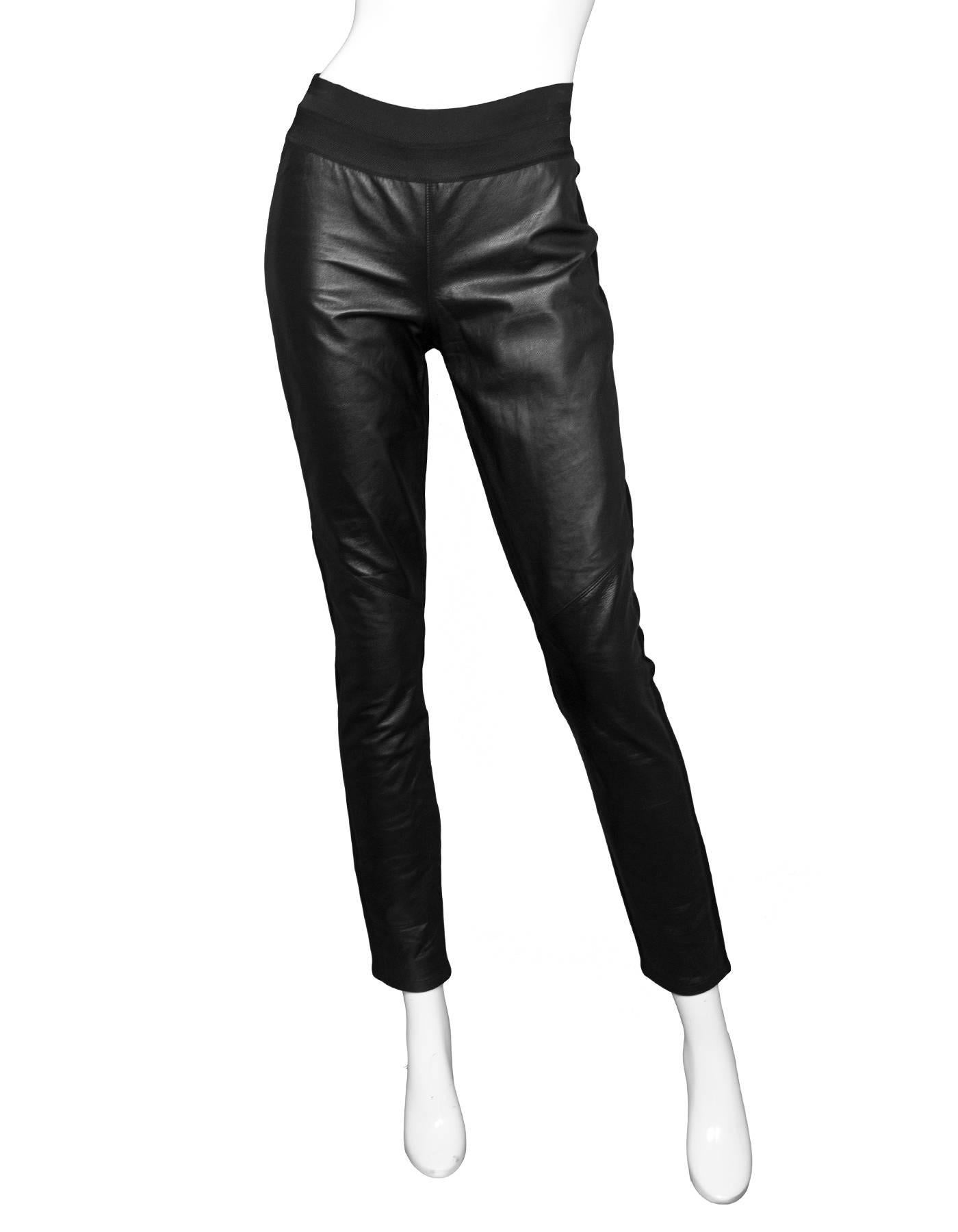 Paige Black Leather Leggings Sz L
Features stretch waistband

Made In: China
Color: Black
Closure/Opening: Pull-up
Composition: Genuine leather, 65% rayon, 30% nylon, 5% elastane
Exterior Pockets: None
Interior Pockets: None
Overall Condition: