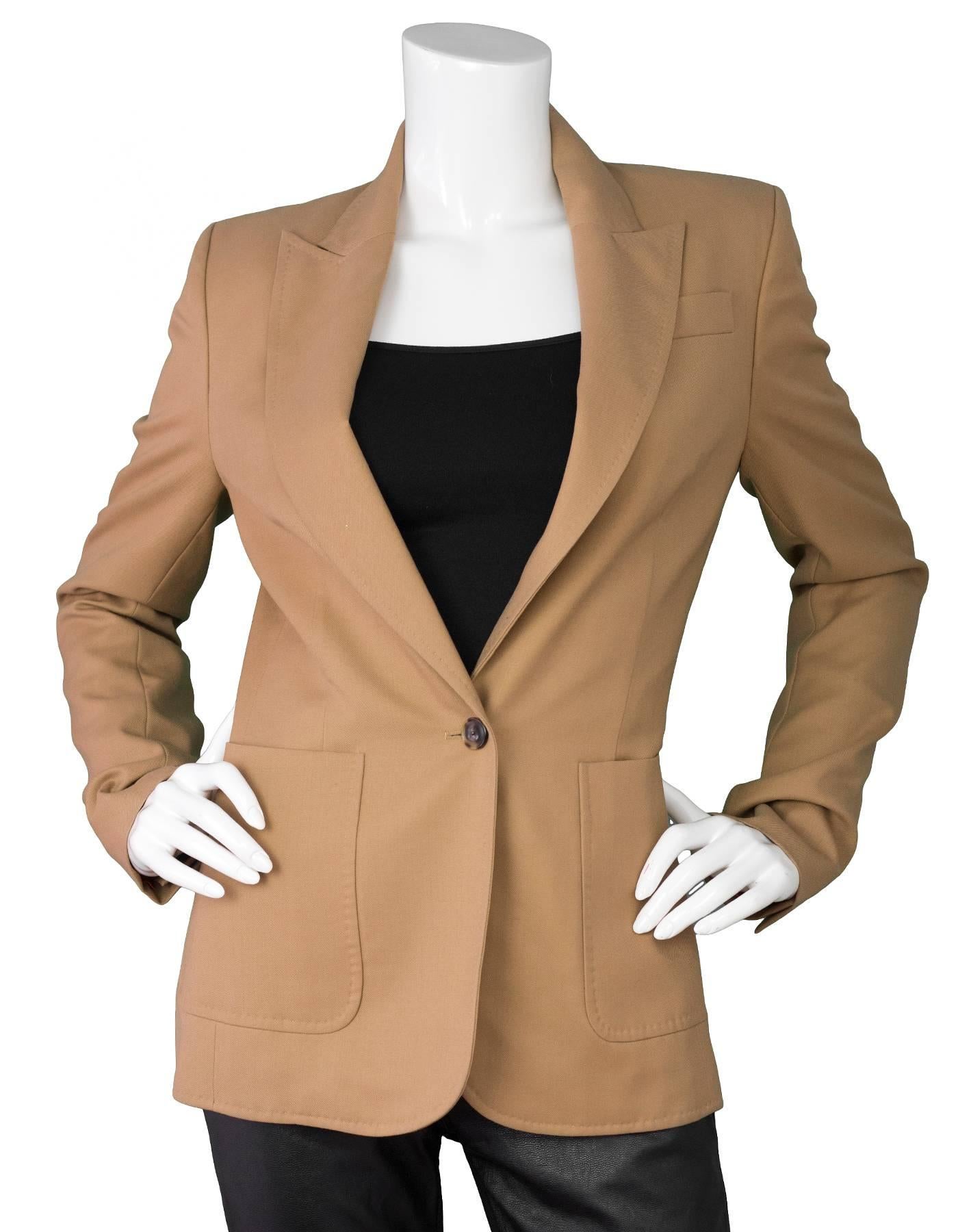 Veronique Branquinho Camel Wool Blazer Sz IT40
Features notch lapels

Made In: Italy
Color: Camel
Composition: 100% virgin wool
Lining: Orange textile
Closure/Opening: Button closure
Exterior Pockets: Patch pockets
Interior Pockets: None
Overall