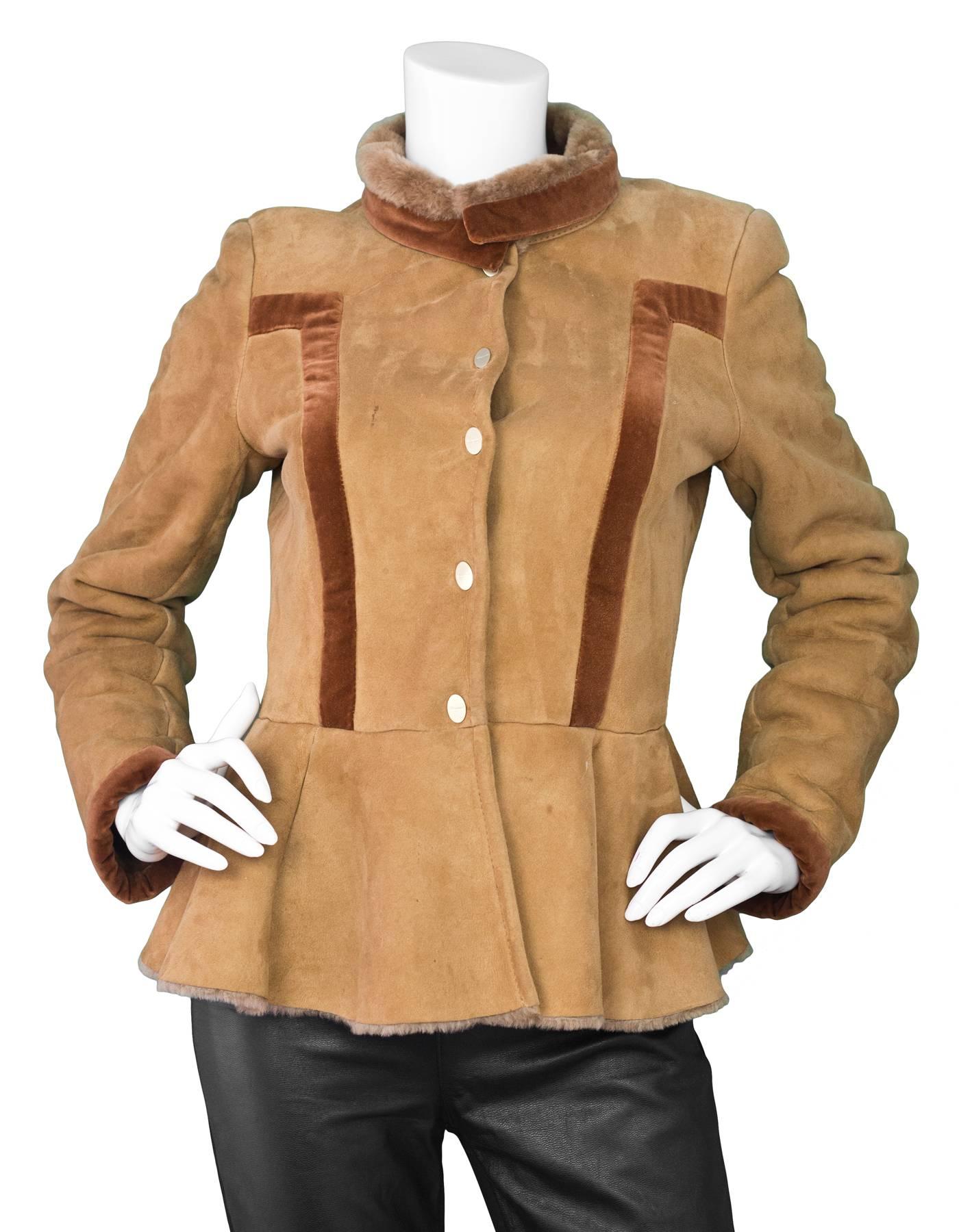 Salvatore Ferragamo Camel Shearling Jacket Sz 8
Features peplum hemline

Made In: Italy
Color: Camel
Composition: 82% Cotton, 18% modal
Closure/Opening: Front snap button closure
Exterior Pockets: Nnoe
Interior Pockets: None
Overall Condition: