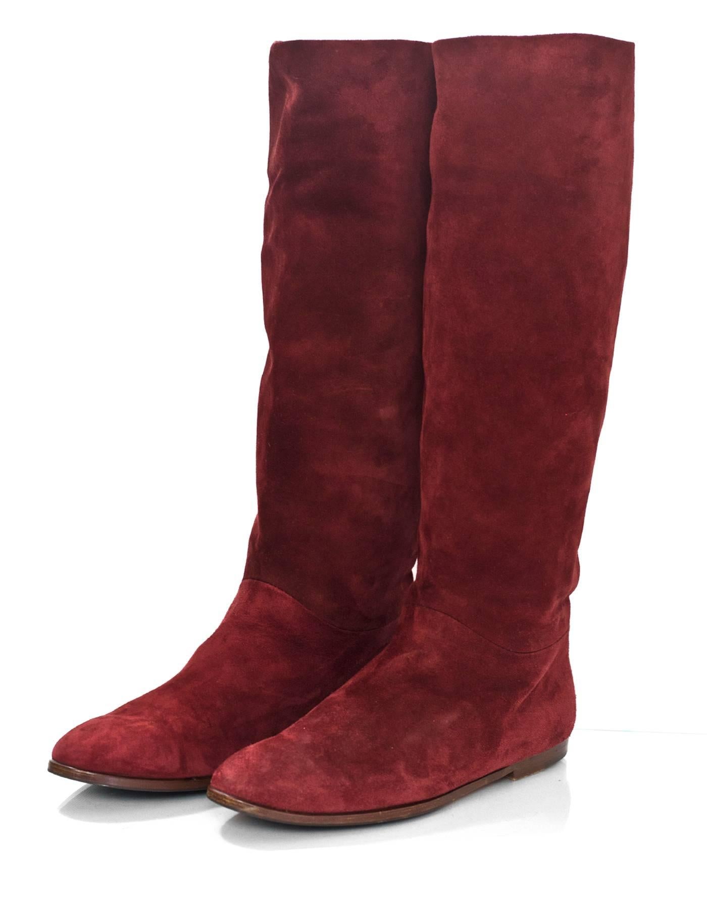 Gucci Burgundy Suede Boots Sz 40

Made In: Italy
Color: Burgundy
Materials: Suede
Closure/Opening: Pull on
Sole Stamp: Gucci Made in Italy 40B
Overall Condition: Excellent pre-owned condition with the exception of being re-soled, light soiling at