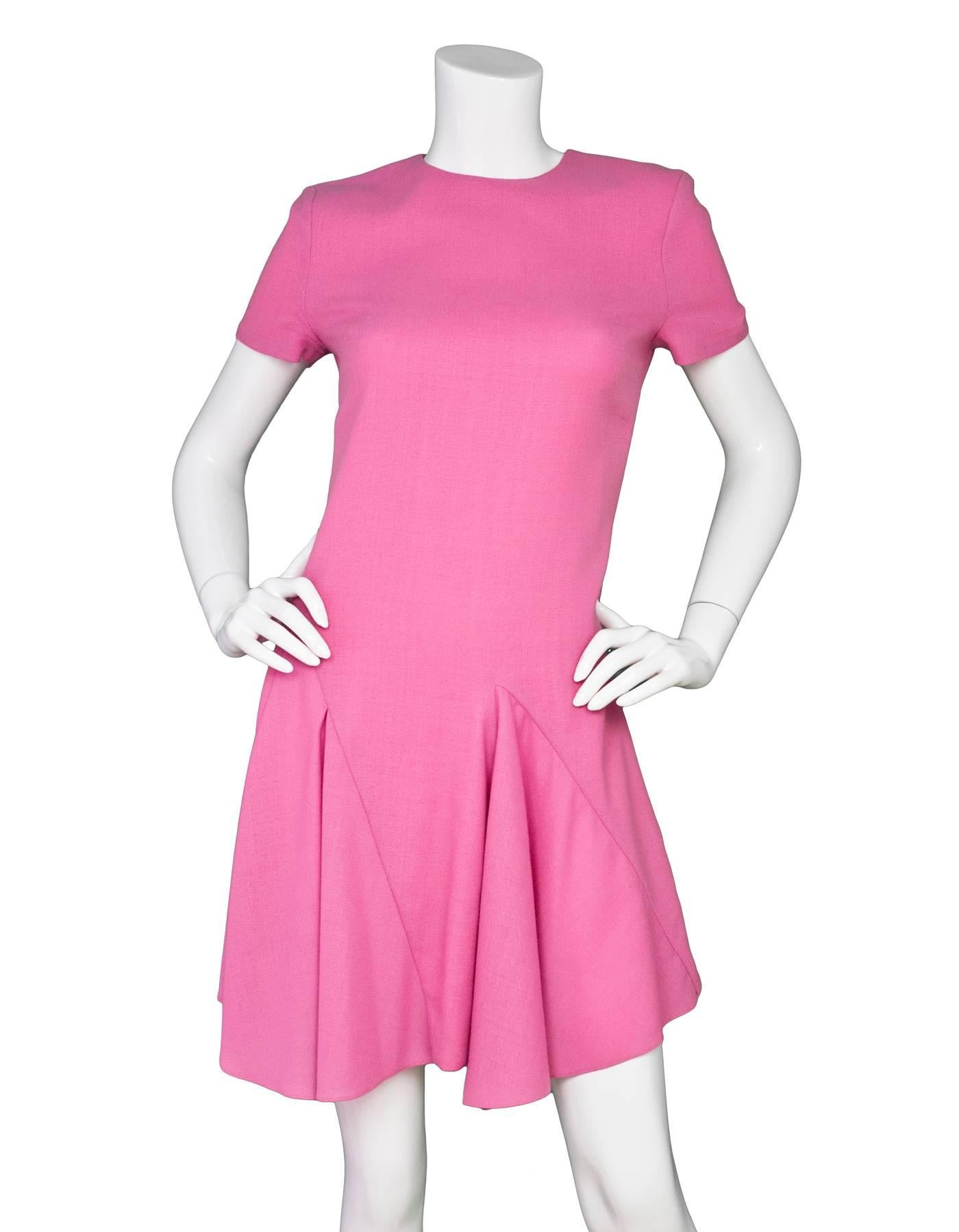 Christian Dior Pink Wool Dress Sz 6

Made In: France
Color: Pink
Composition: 100% Wool
Lining: Pink silk
Closure/Opening: Zip closure at back
Exterior Pockets: None
Interior Pockets: None
Overall Condition: Excellent pre-owned condition
Marked