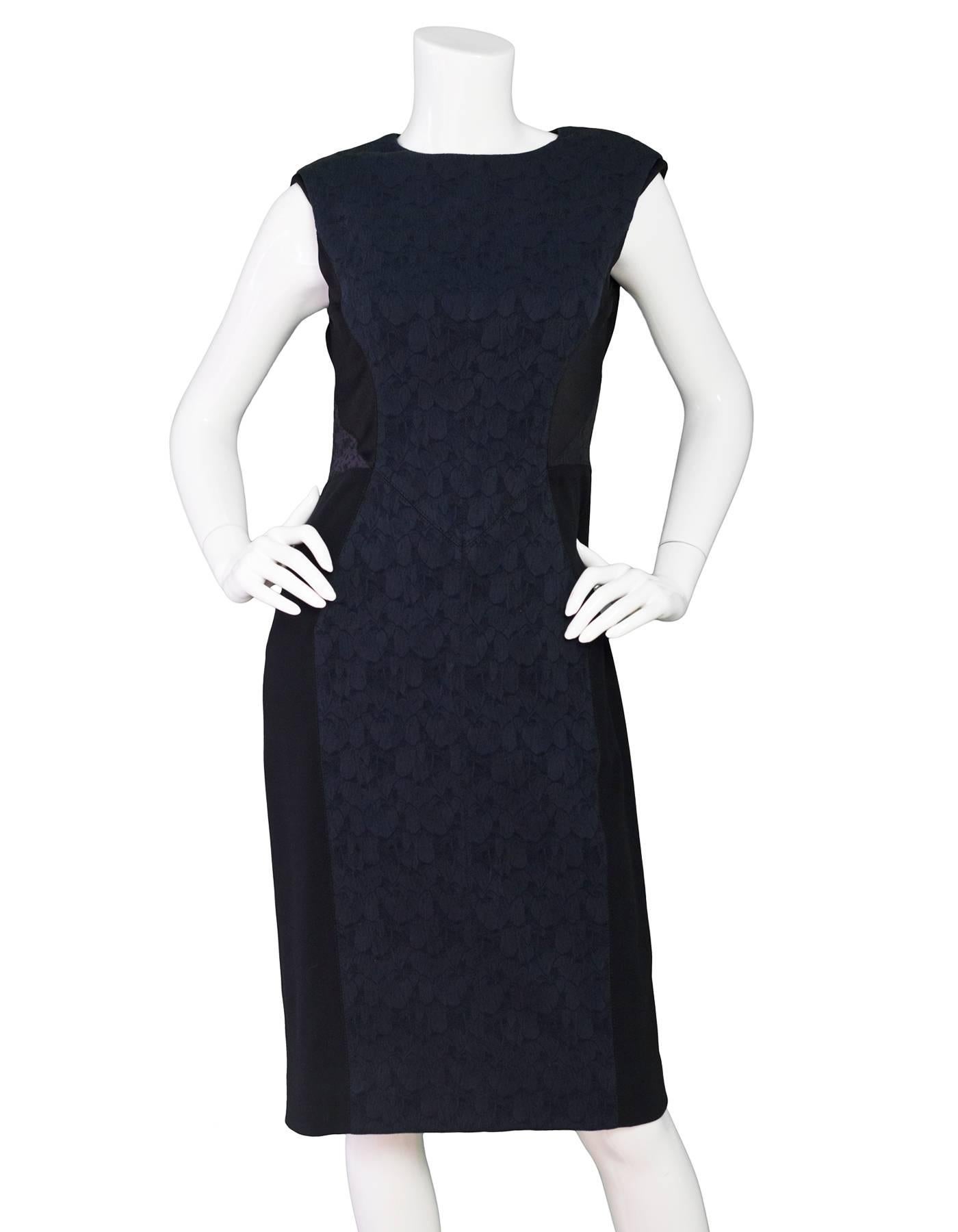 J. Mendel Black & Navy Print Dress Sz 6

Made In: USA
Color: Black, navy
Composition: 49% cotton, 25% polyamide, 24% viscose, 2% elastine
Lining: Black textile
Closure/Opening: Zip up back
Exterior Pockets: None
Overall Condition: Excellent