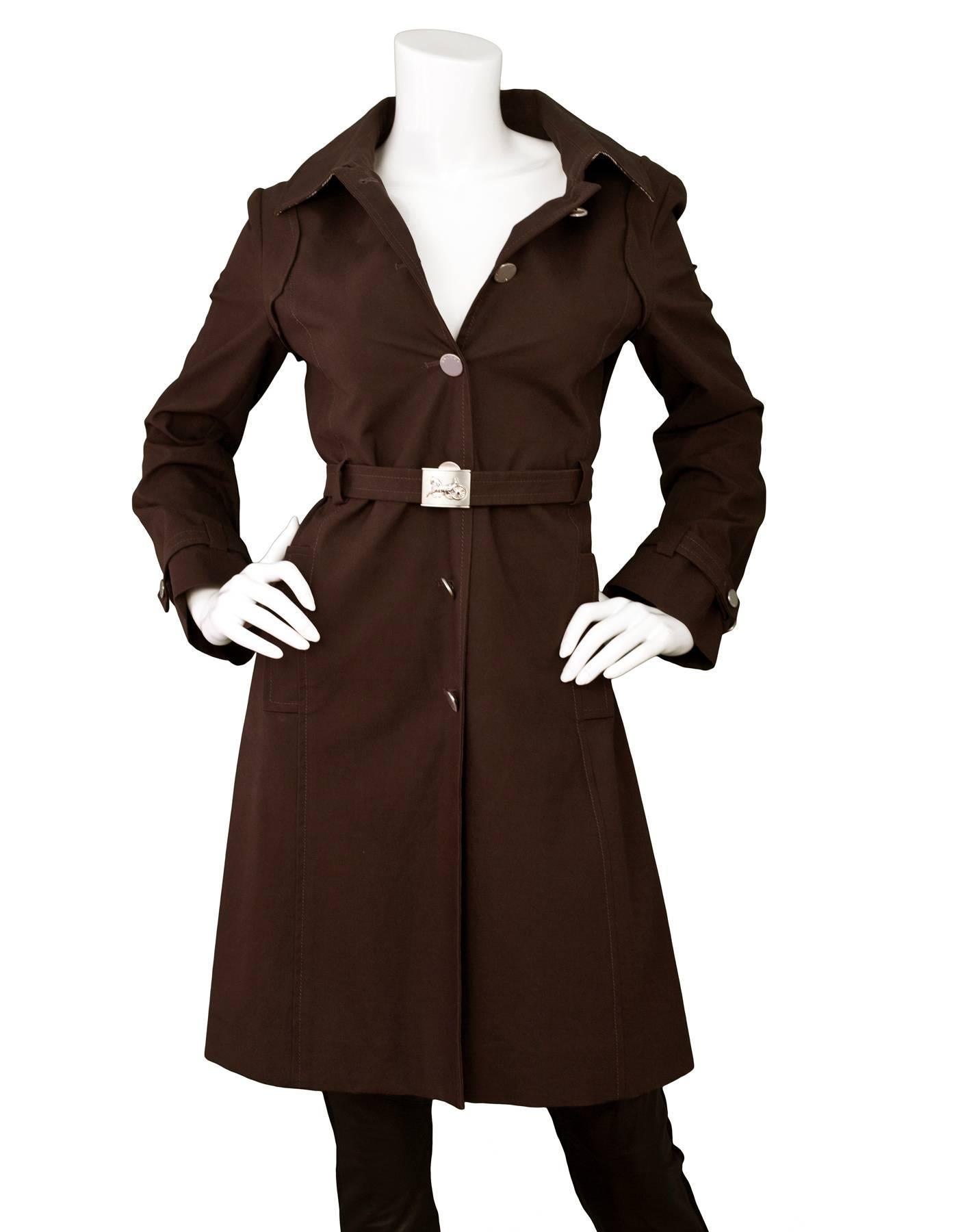 Celine Brown Trench Coat Sz IT40

Made In: Slovania
Color: Brown
Composition: 88% cotton, 12% polyurethane
Lining: Brown textile
Closure/Opening: Front button closure
Exterior Pockets: Side hip pockets
Overall Condition: Excellent pre-owned