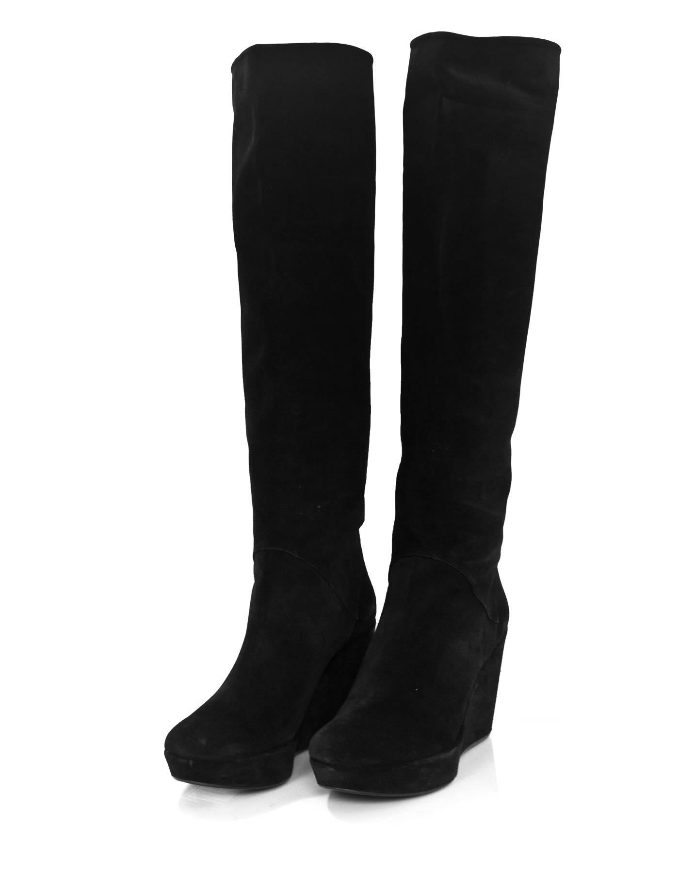 Stuart Weitzman Black Suede Nulinear Wedge Boots Sz 11

Made In: Spain
Color: Black
Materials: Suede
Closure/Opening: Pull on
Sole Stamp: Made in Spain
Overall Condition: Excellent pre-owned condition
Includes: Stuart Weitzman box
Marked Size: