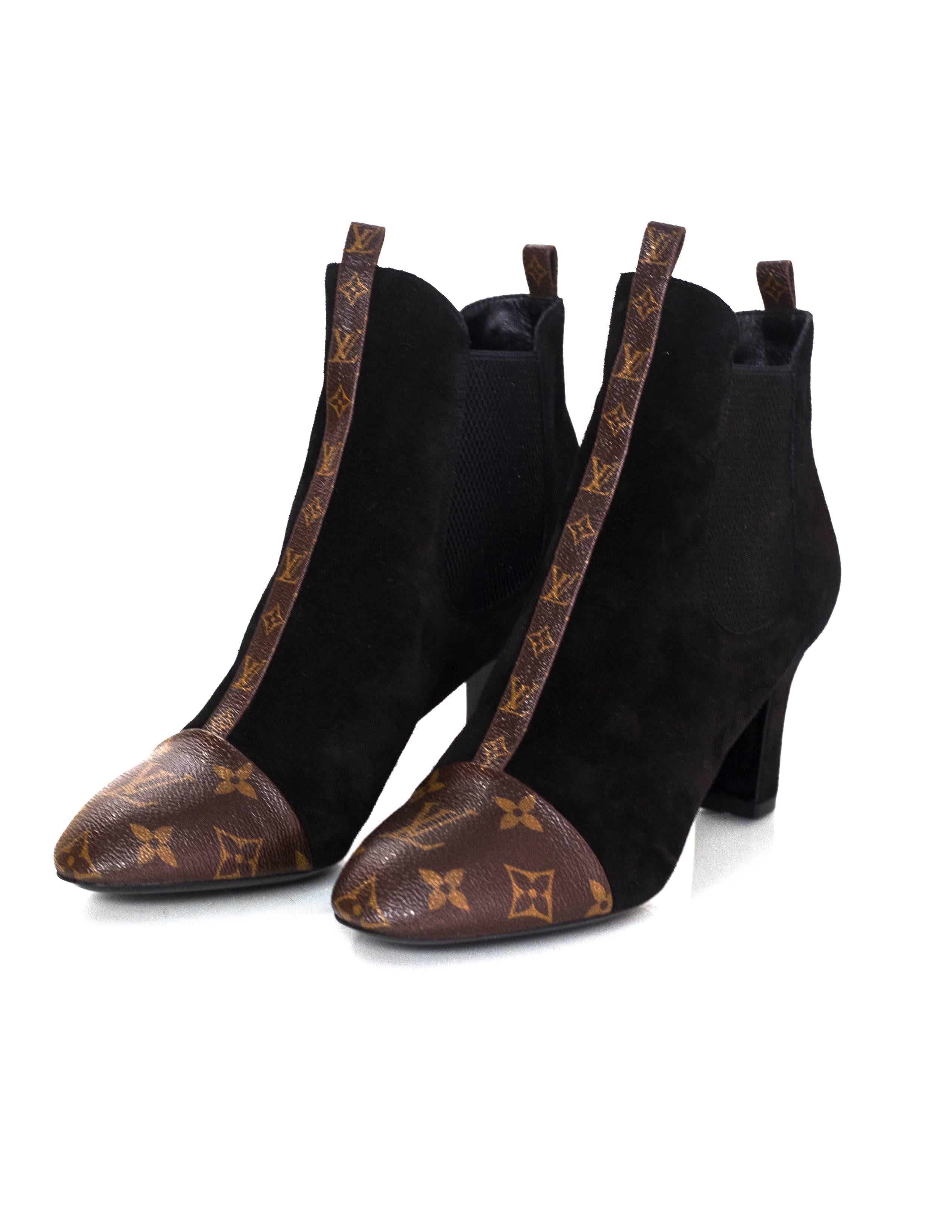 Louis Vuitton Black Suede & Monogram Revival Booties Sz 39.5 NEW

Made In: Italy
Color: Black, brown
Materials: Suede, coated canvas
Closure/Opening: Slide on with stretch sides
Sole Stamp: Made in Italy 39.5 LV
Overall Condition: Excellent