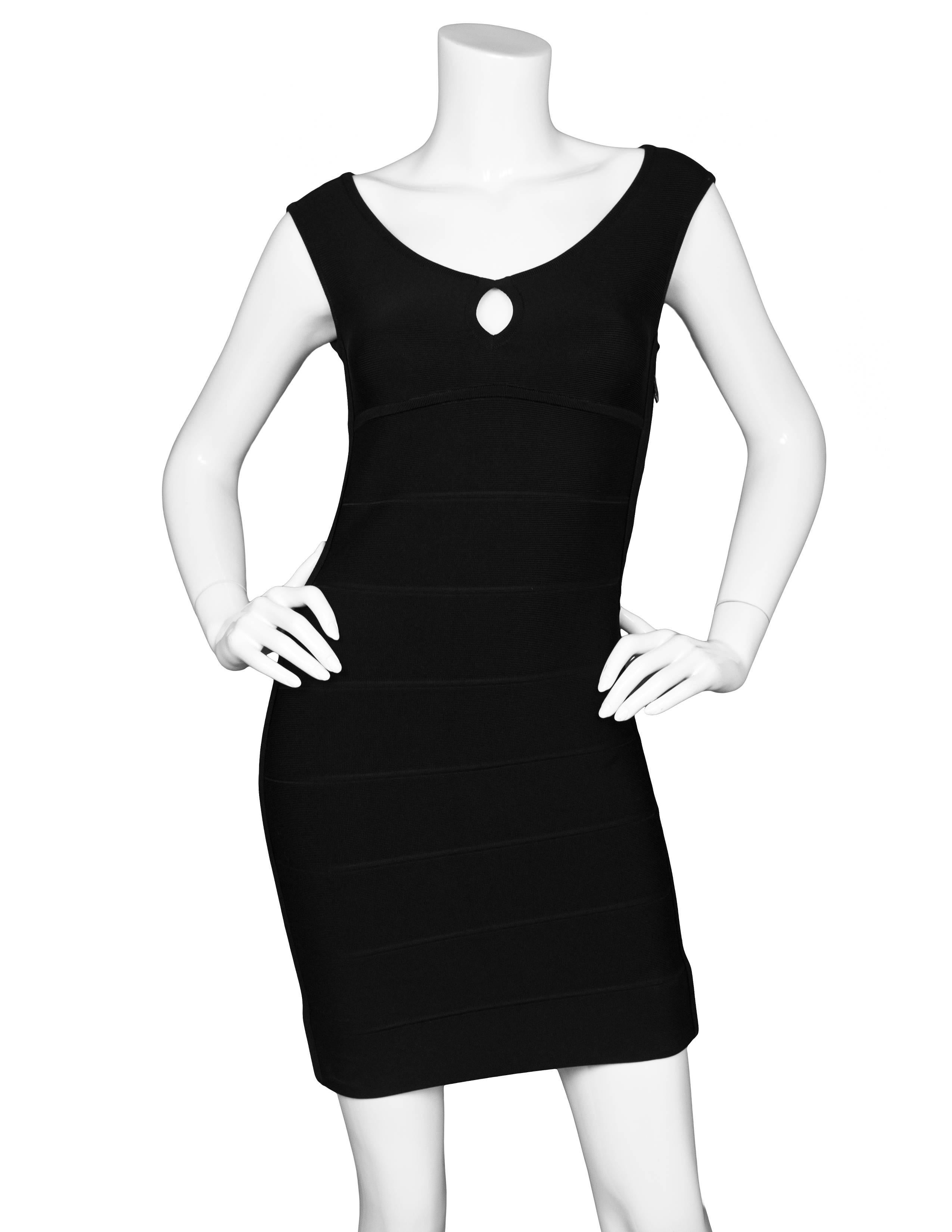 Herve Leger Black Bandage Dress Sz S

Made In: China
Color: Black
Composition: 90% Rayon, 9% Nylon, 1% Spandex
Lining: None
Closure/Opening: Zip closure at side
Overall Conditon: Excellent pre-owned condition with the exception of being
