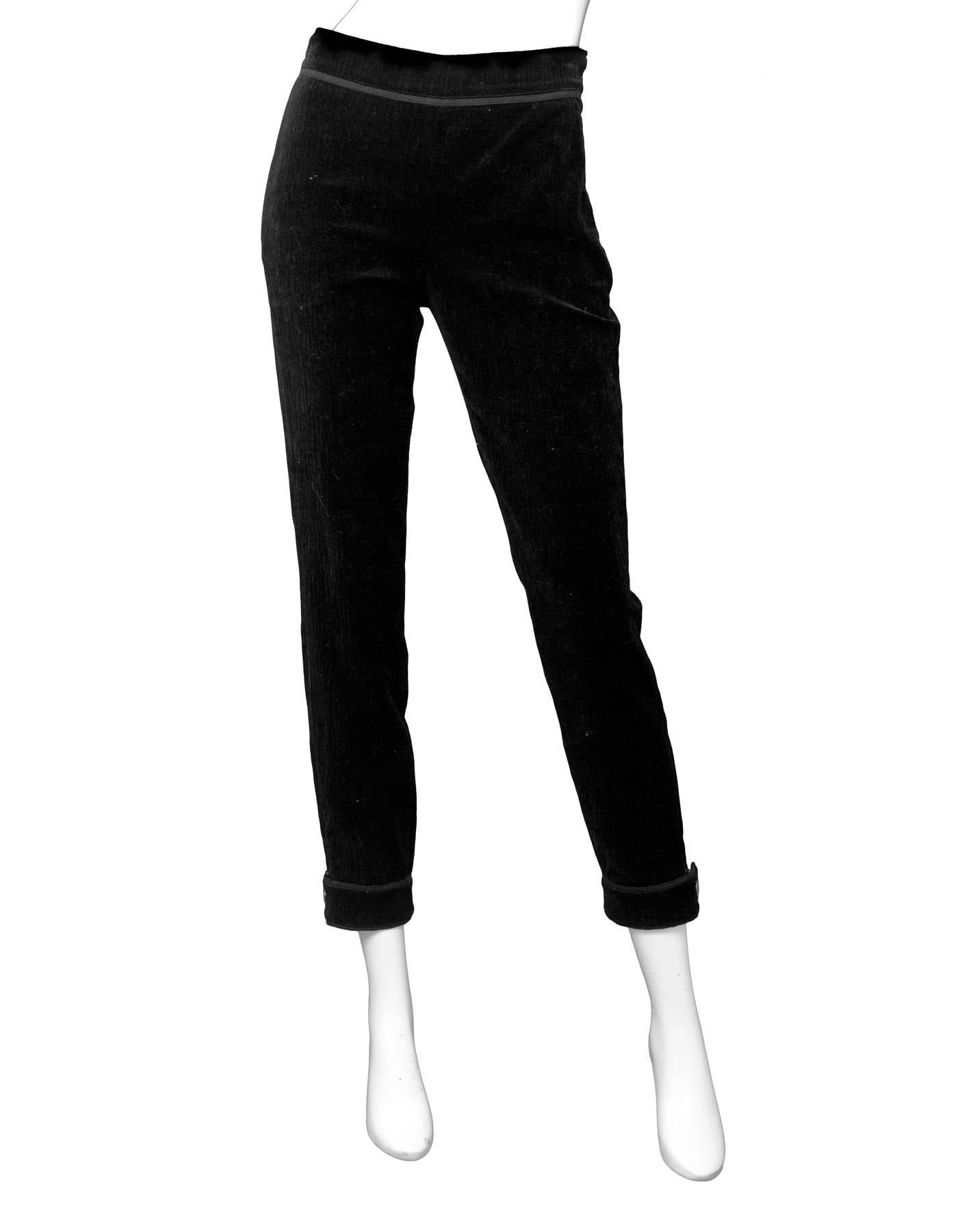 Chanel Black Velvet Pants Sz FR38

Features zipper and button details at ankles

Made In: Italy
Color: Black
Composition: 99% Cotton, 1% spandex
Lining: Black textile
Closure/Opening: Side zip closure
Exterior Pockets: None
Overall Condition: