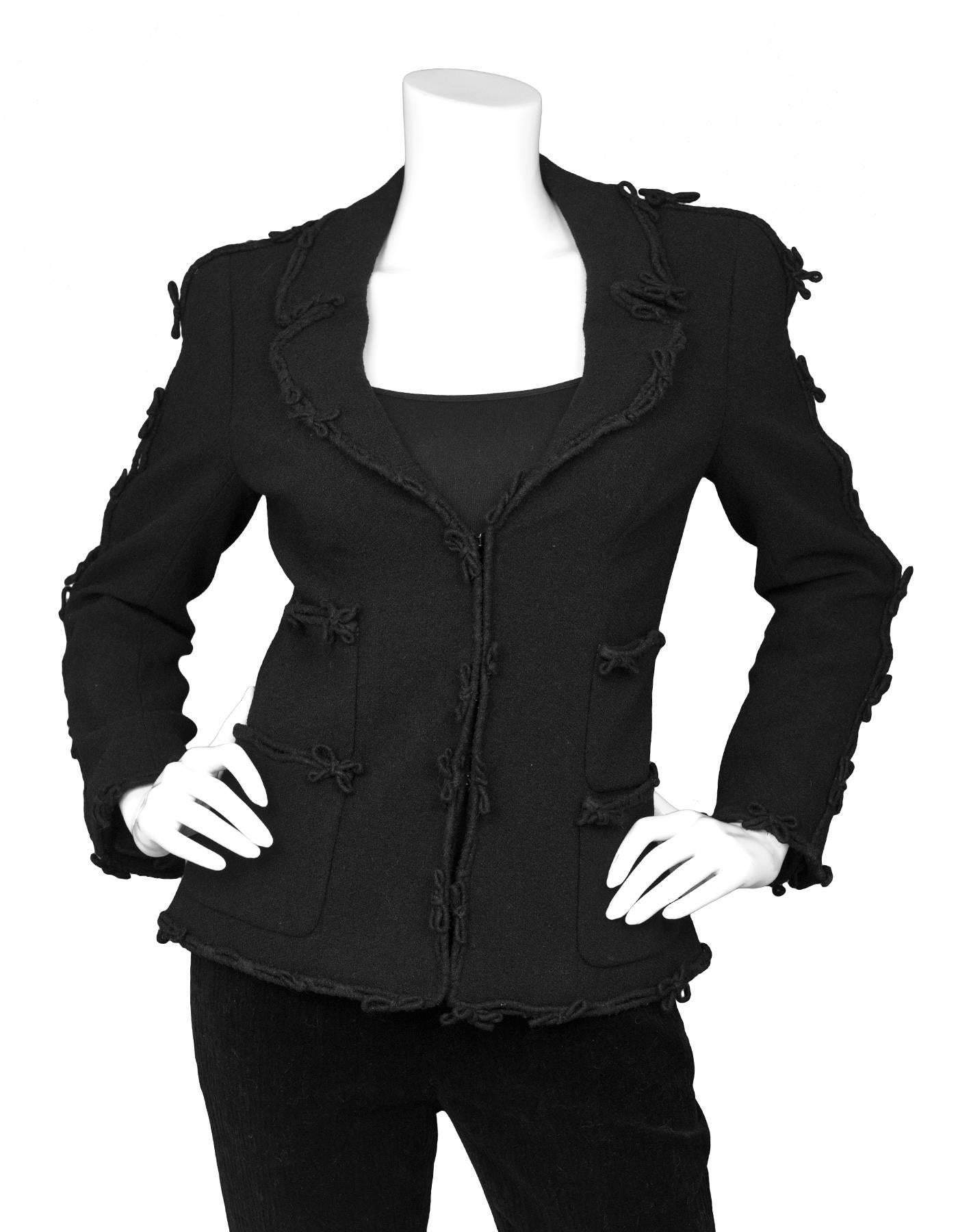 Chanel Black Wool Jacket with Bow Trim Detail Sz FR38

Made In: France
Color: Black
Composition: 84% wool, 16% nylon
Lining: Black, 100% silk
Closure/Opening: Front hook and eye closure
Exterior Pockets: Four front pockets
Overall Condition: