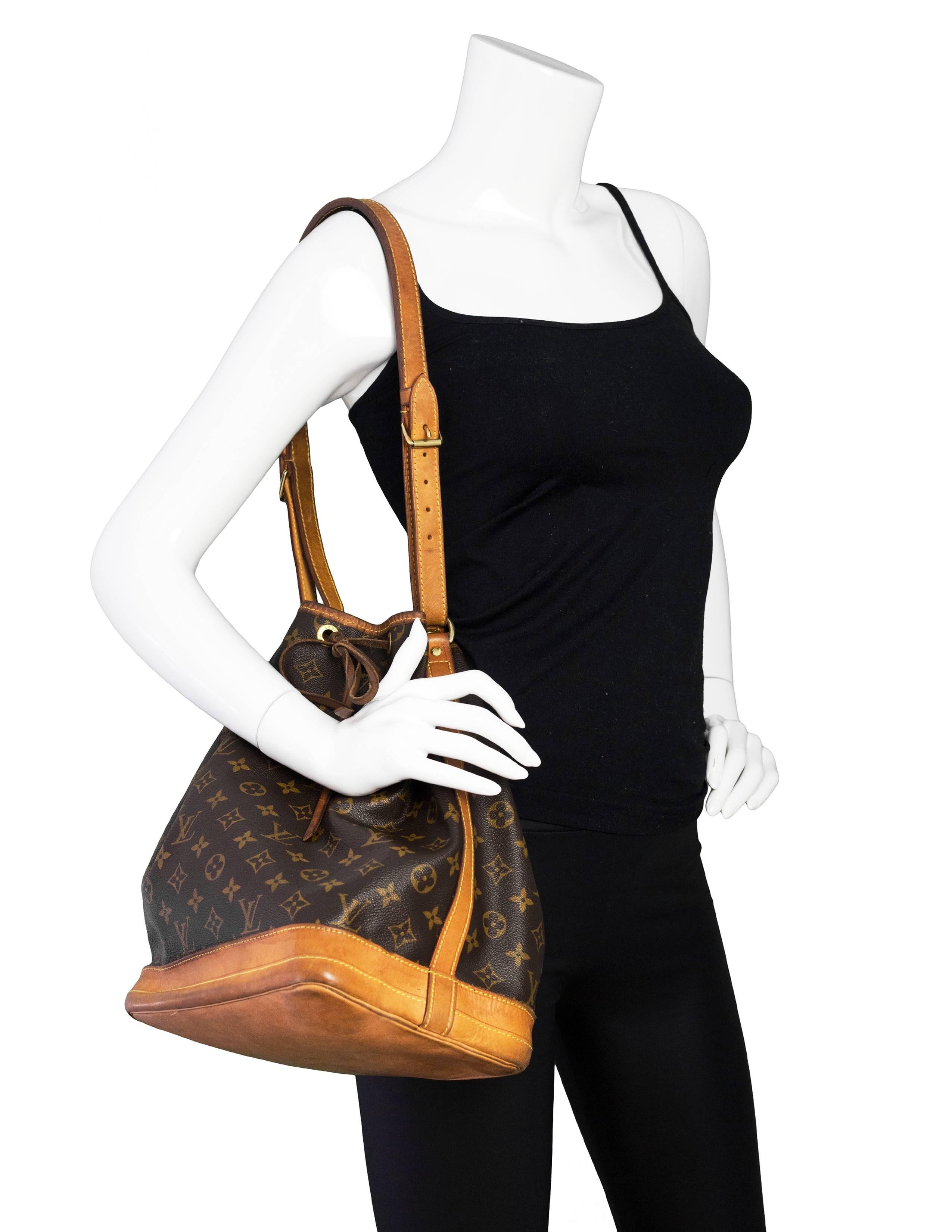 Louis Vuitton Vintage Monogram Noe Bucket Bag

Made In: France
Color: Brown and tan
Hardware: Goldtone
Materials: Coated canvas, vachetta leather
Lining: Brown canvas
Closure/Opening: Open top with vachetta drawstring tie closure
Retail Price: