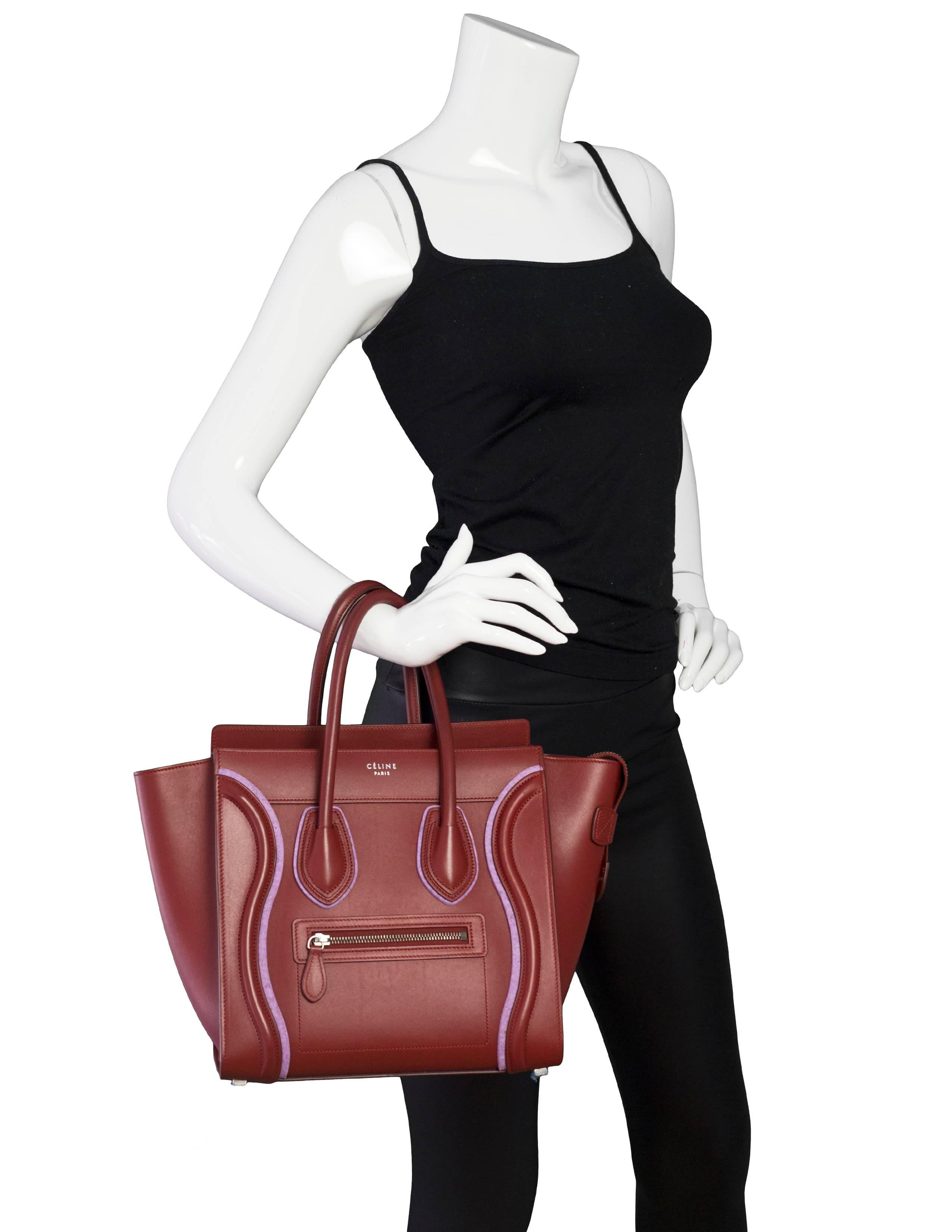 Celine Merlot & Purple Felt Micro Luggage Tote

Made In: Italy
Color: Merlot, purple
Hardware: Goldtone
Materials: Leather, felt
Lining: Merlot leather
Closure/Opening: Zip top
Exterior Pockets: One small zip pocket
Interior Pockets: Two patch