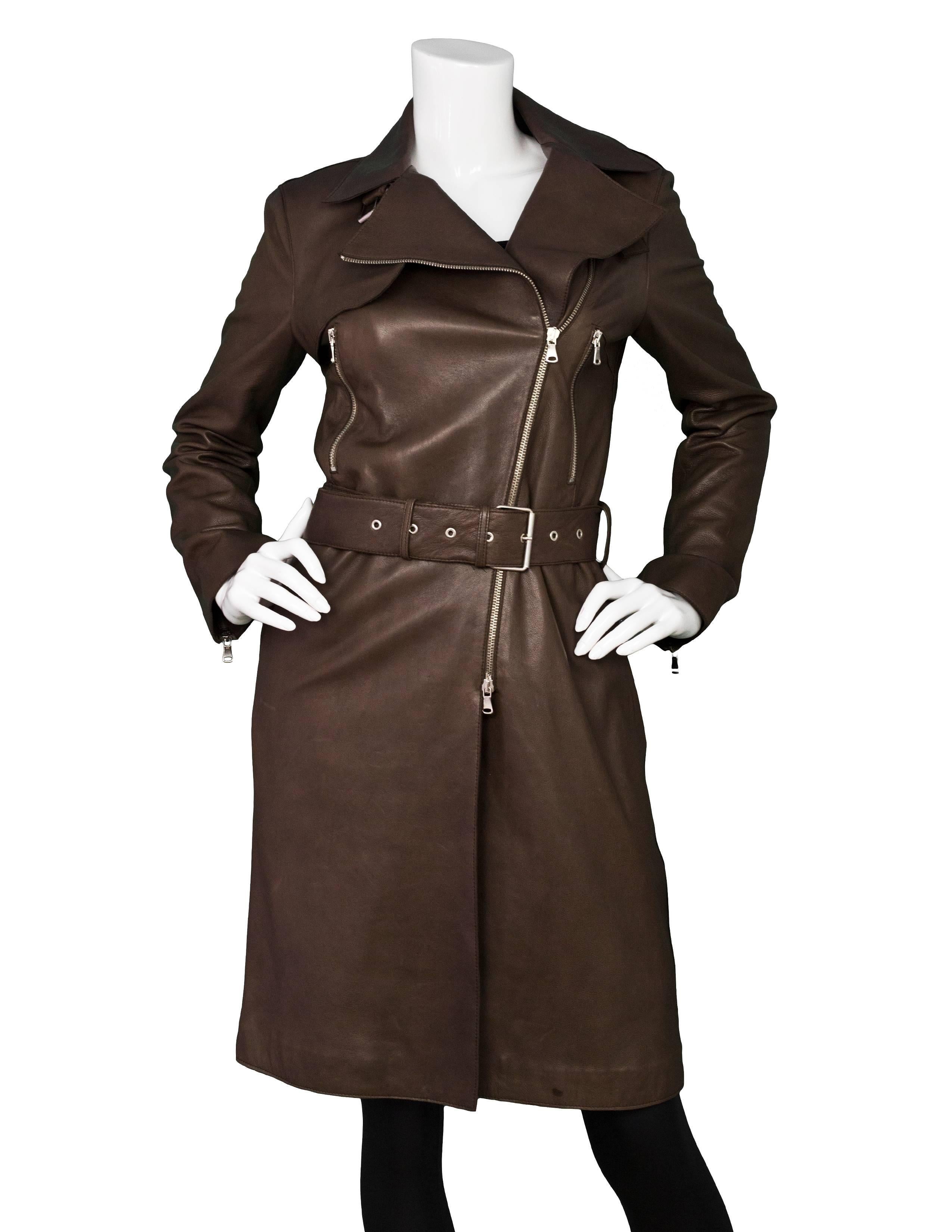Joseph Brown Leather Moto Trench Coat Sz FR36

Made In: Italy
Color: Brown
Composition: 100% lambskin
Lining: Charcoal textile
Closure/Opening: Double zip front
Overall Condition: Very good pre-owned condition with the exception of some marks