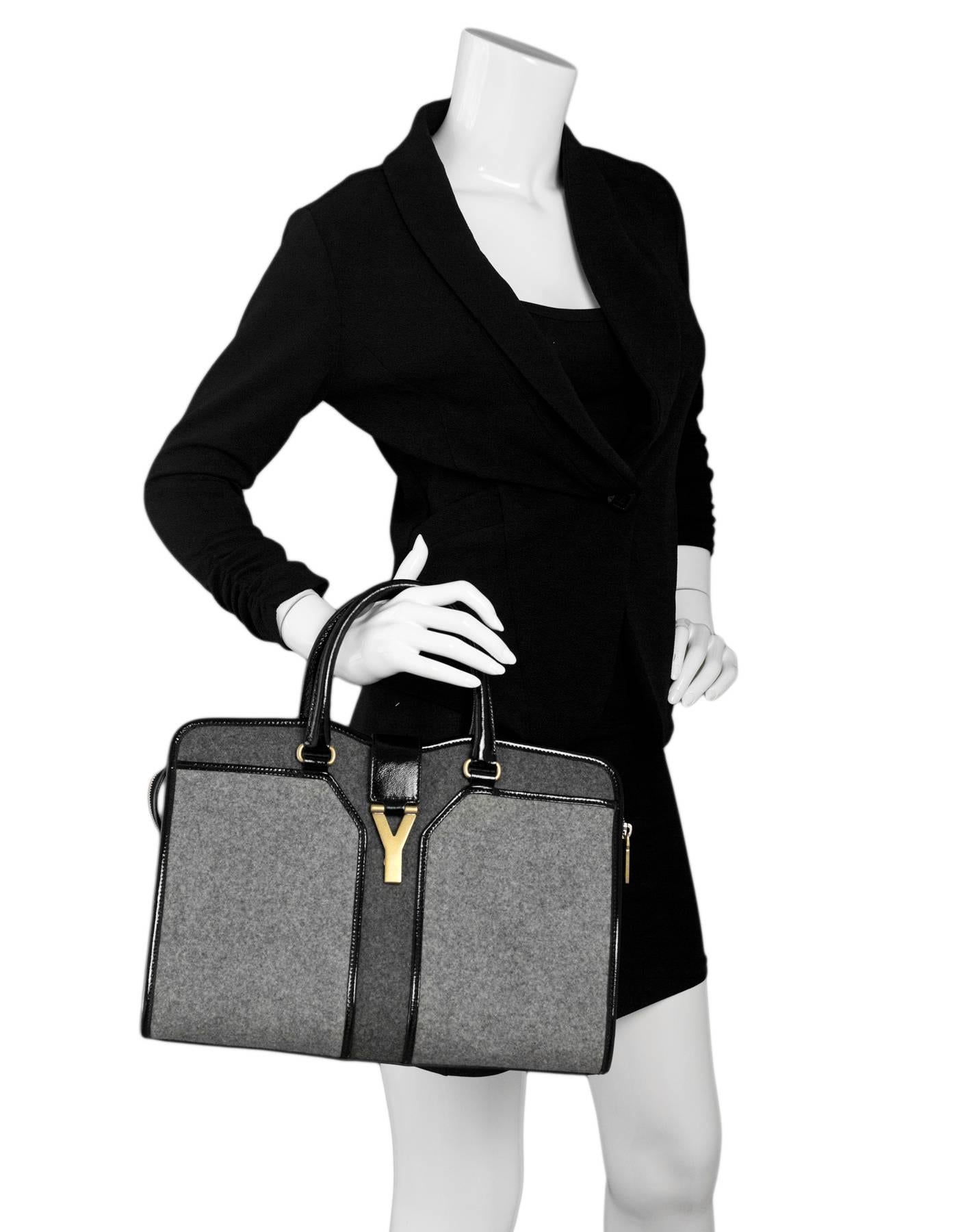 Yves Saint Laurent Cabas ChYc Medium Wool-Felt and Patent Leather Tote

Made In: Italy
Color: Grey, black
Hardware: Goldtone
Materials: wool-felt, patent leather, metal
Lining: Black textile
Closure/Opening: Double zip top with center Y