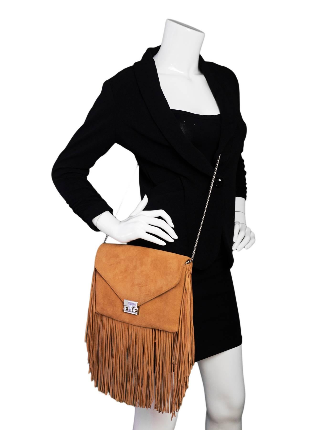 Loeffler Randall Desert Nude Suede Fringe Envelope Bag
Features fringe trim throughout

Made In: China
Color: Desert nude / tan
Hardware: Silvertone
Materials: Suede, metal
Lining: Black and white textile
Closure/opening: Flap top with push