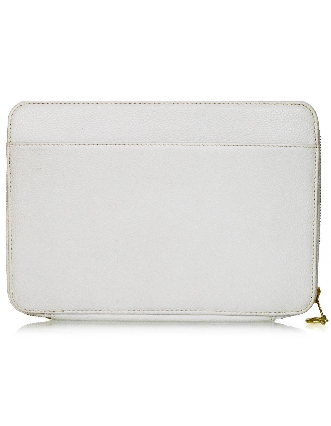 Chanel White Caviar Leather Timeless CC XLClutch/Folio 
Features CC stitched on front panel

Made In: Italy
Year of Production: 1997-1999
Color: White
Hardware: Goldtone
Materials: Caviar leather
Lining: Beige nylon
Closure/Opening: Zip around