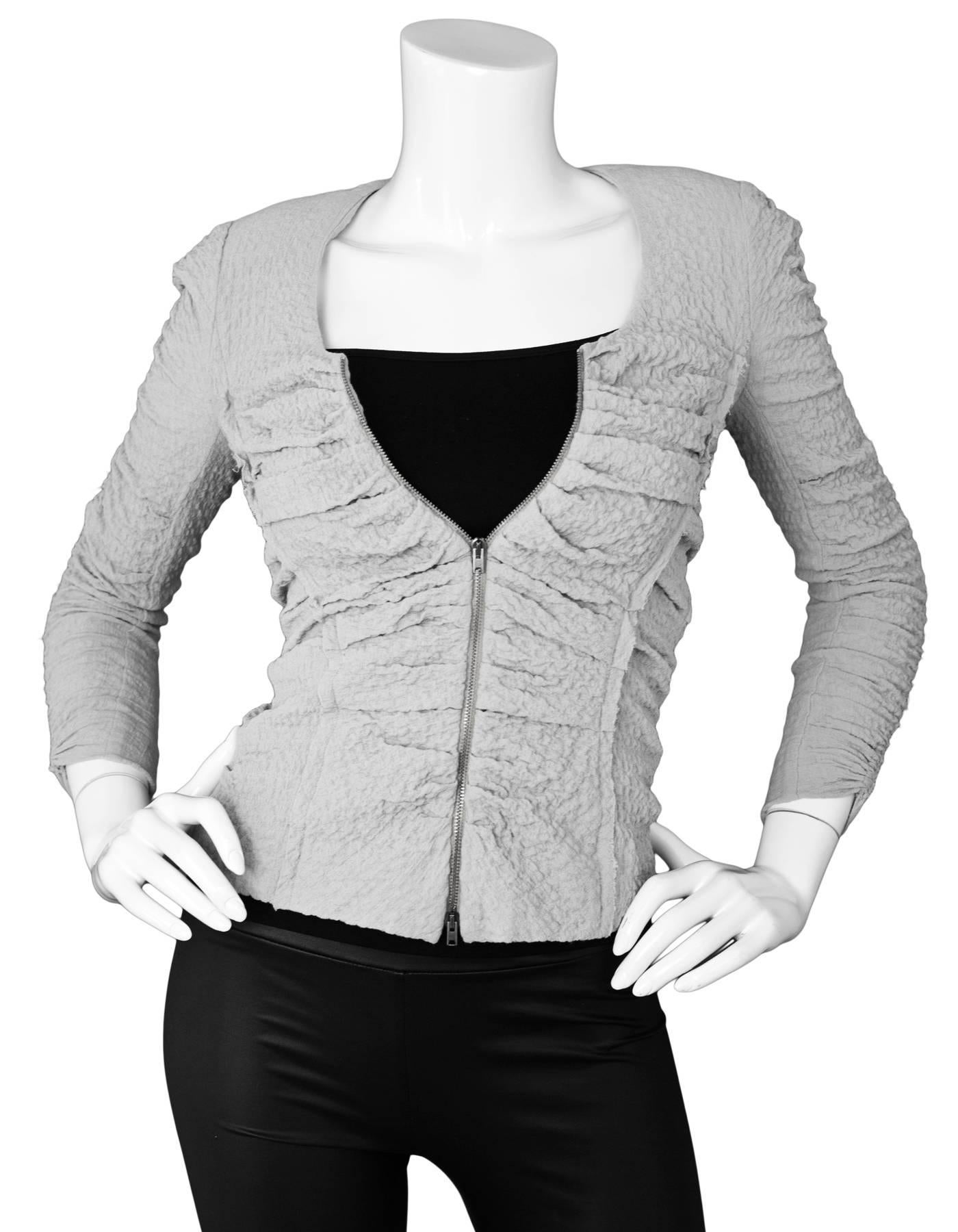 Isabel Marant Grey Crepe Ruched Jacket Sz Small

Made In: Slovakia
Color: Grey
Composition: 68% Viscose, 31% wool, 1% elastane
Lining: None
Closure/Opening: Front double zip closure
Exterior Pockets: None
Interior Pockets: None
Overall Condition:
