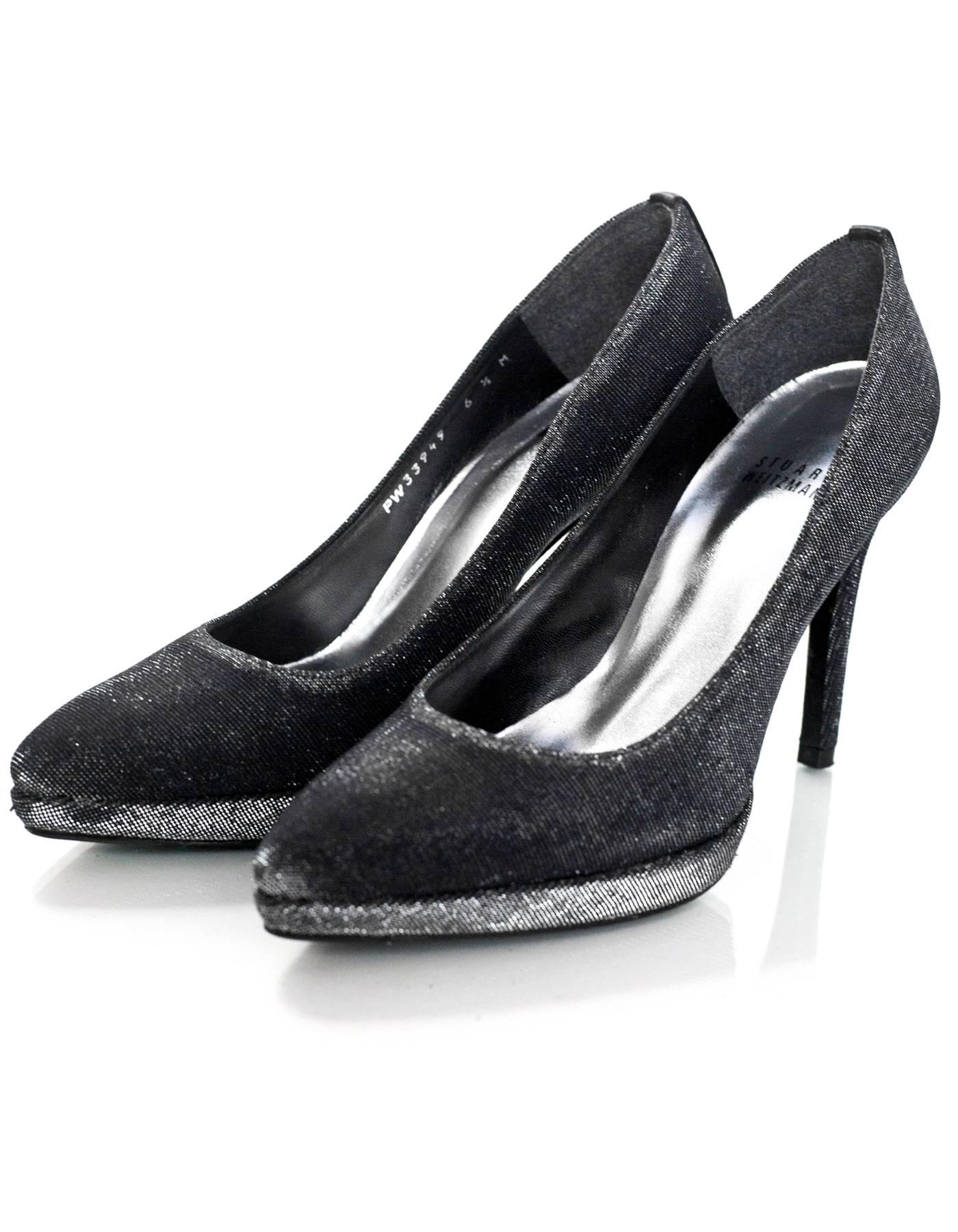 Stuart Weitzman Black Metallic Pumps Sz 6.5M

Made In: Spain
Color: Black/silver
Materials: Nylon-blend
Closure/Opening: Slide on
Sole Stamp: Stuart Weitzman Leather Sole Made In Spain
Overall Condition: Excellent pre-owned condition with the