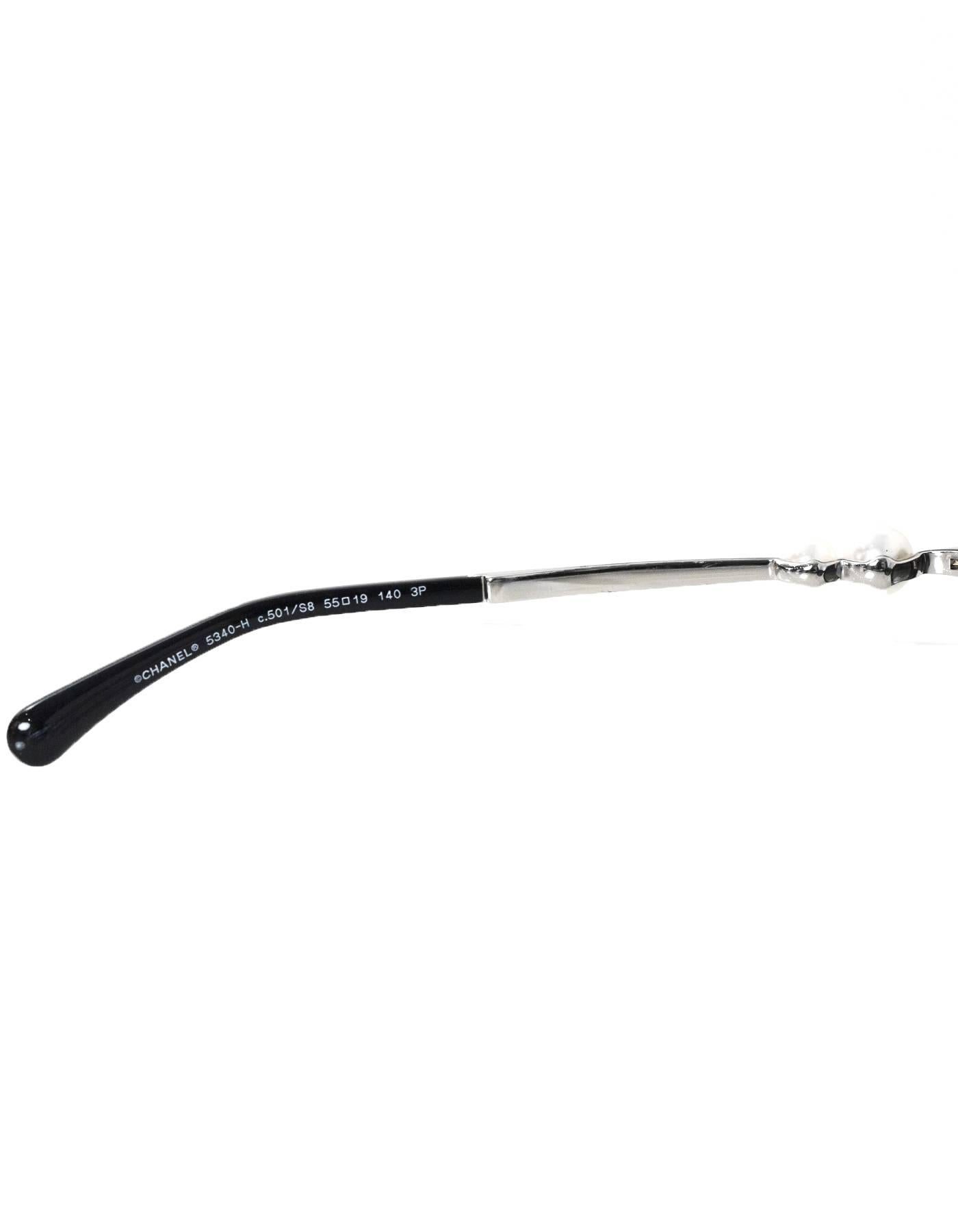 Chanel Black Cat-Eye Polarized Sunglasses with Pearl Arms with Box rt. $650 In Excellent Condition In New York, NY