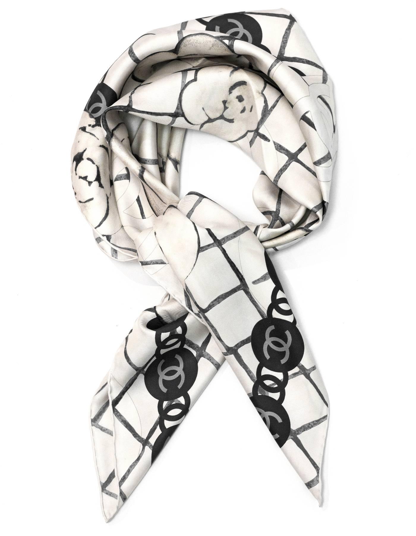 Chanel White & Grey CC Camelia Silk Scarf

Made In: Italy
Color: Grey, white
Composition: 100% silk
Overall Condition: Excellent pre-owned condition
Included: Chanel box and ribbon

Measurements:
Length: 35"
Width: 35"