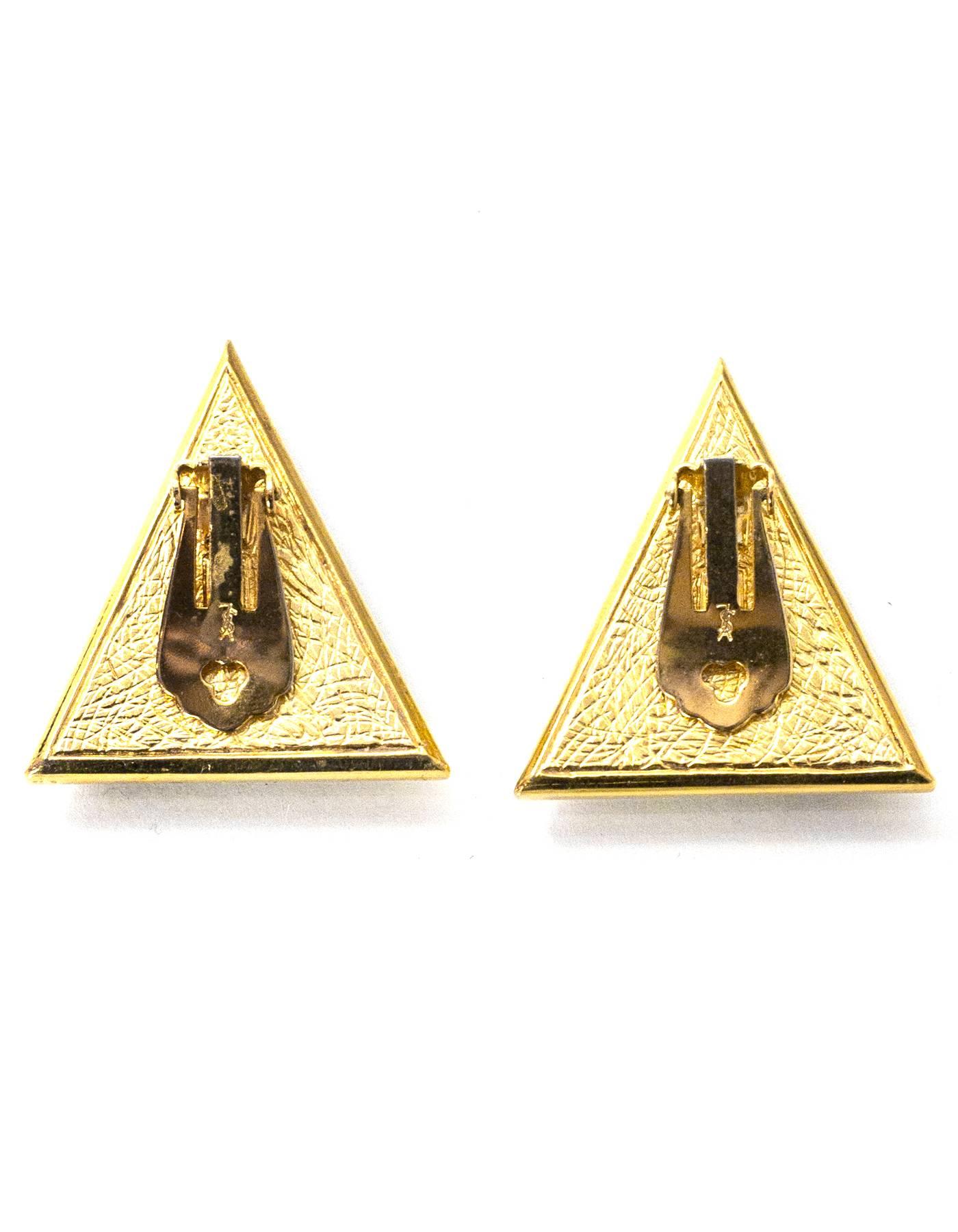 Yves Saint Laurent Vintage Triangle Pave Clip-On Earrings

Color: Gold, blue, black, white
Materials: Metal, enamel, crystal
Closure: Clip-on
Overall Condition: Excellent vintage pre-owned condition
Measurements: 
Length: 1.25"
Width: 1.25"