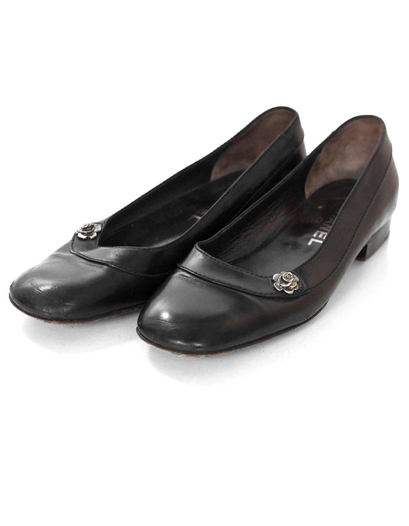 Chanel Black Leather Flats with Camellia Flower Sz 36.5

Made In: Italy
Color: Black
Composition: Leather
Sole Stamp: CC Made in Italy 36.5
Closure/opening: Slide on
Overall Condition: Very good pre-owed conditon with the exception of worn outsoles,