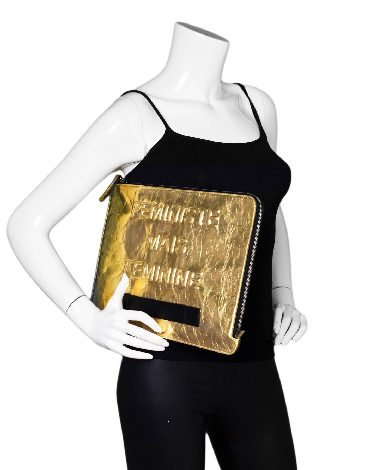 Chanel Gold Crinkled Leather Large Feminist Mais Feminine Clutch 

Made In: Italy
Year of Production: 2015
Color: Gold
Hardware: Ruthenium
Materials: Leather, metal
Lining: Black textile
Closure/Opening: Zip around
Exterior Pockets: One at