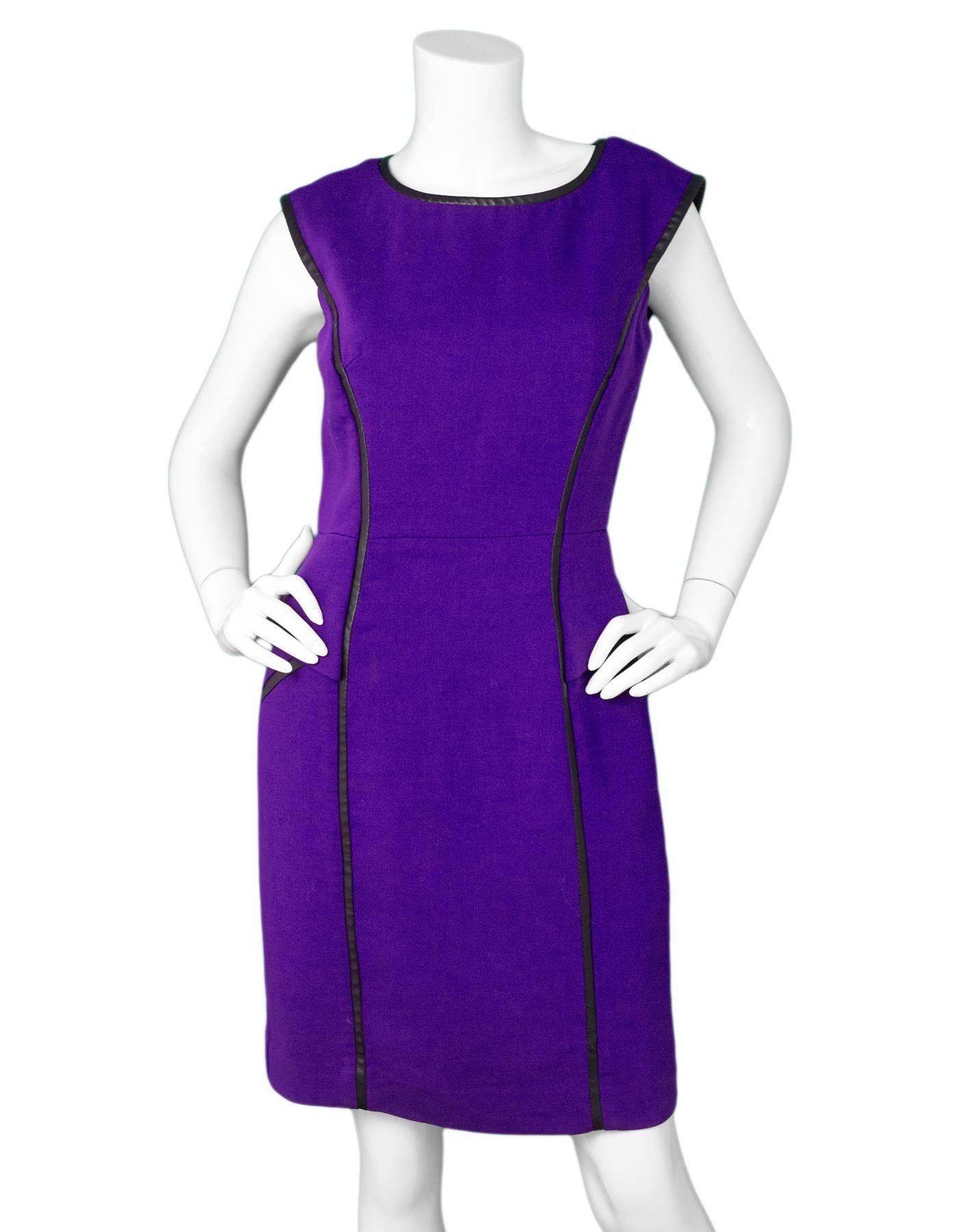 Milly Purple & Faux Leather Trim Dress Sz 10

Made In: USA
Color: Purple, black
Composition: 57% polyester, 21% wool, 20% viscose
Lining: Purple textile
Closure/Opening: Back zip up
Exterior Pockets: None
Interior Pockets: None
Overall Condition: