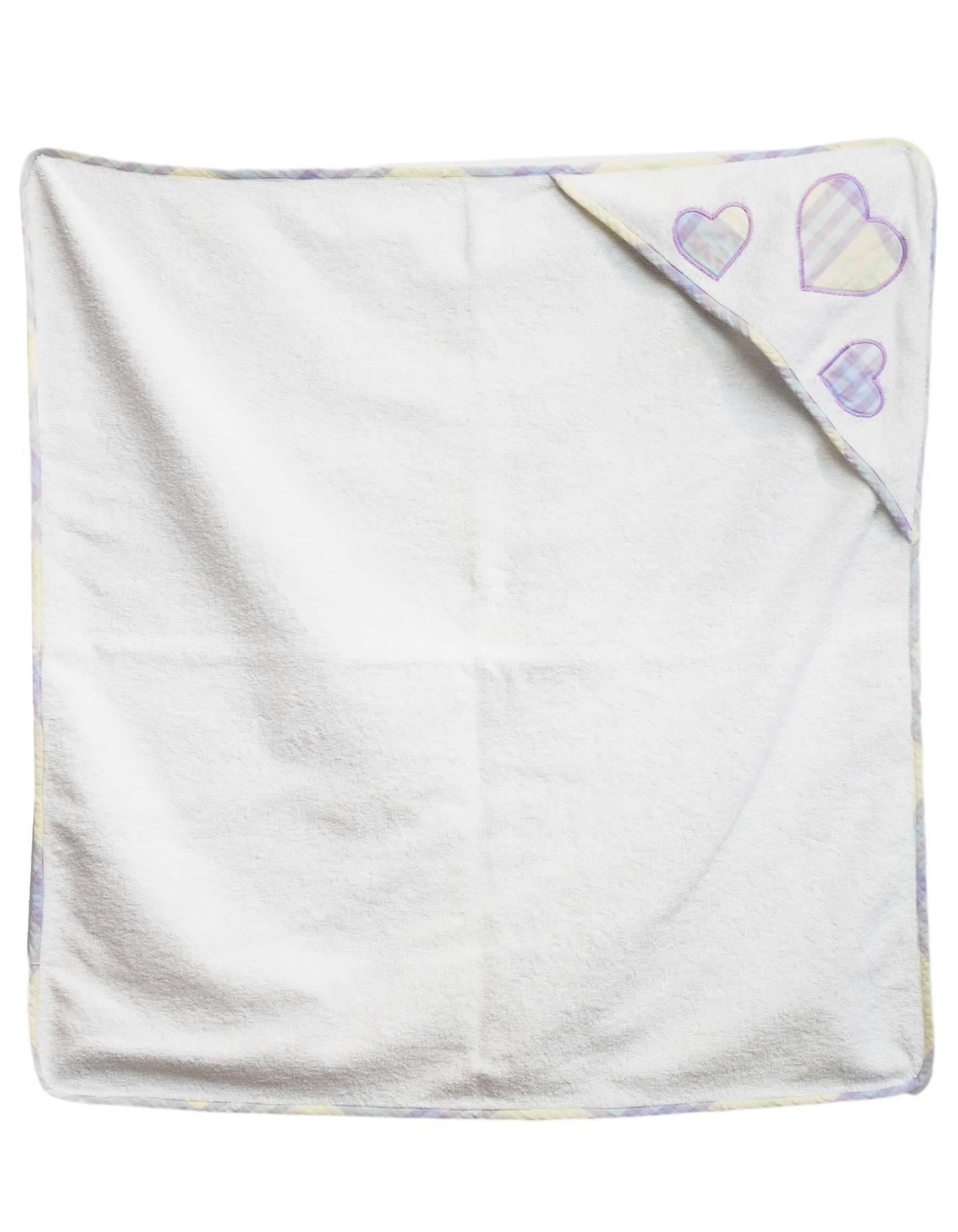 Burberry Purple Plaid Infant Towel Set
Infant hooded towel with holder/pouch. Features plaid trim and hearts.

Color: White, purple
Composition: Not listed, feels like cotton
Overall Condition: Excellent pre-owned condition

Measurements: 
Towel: